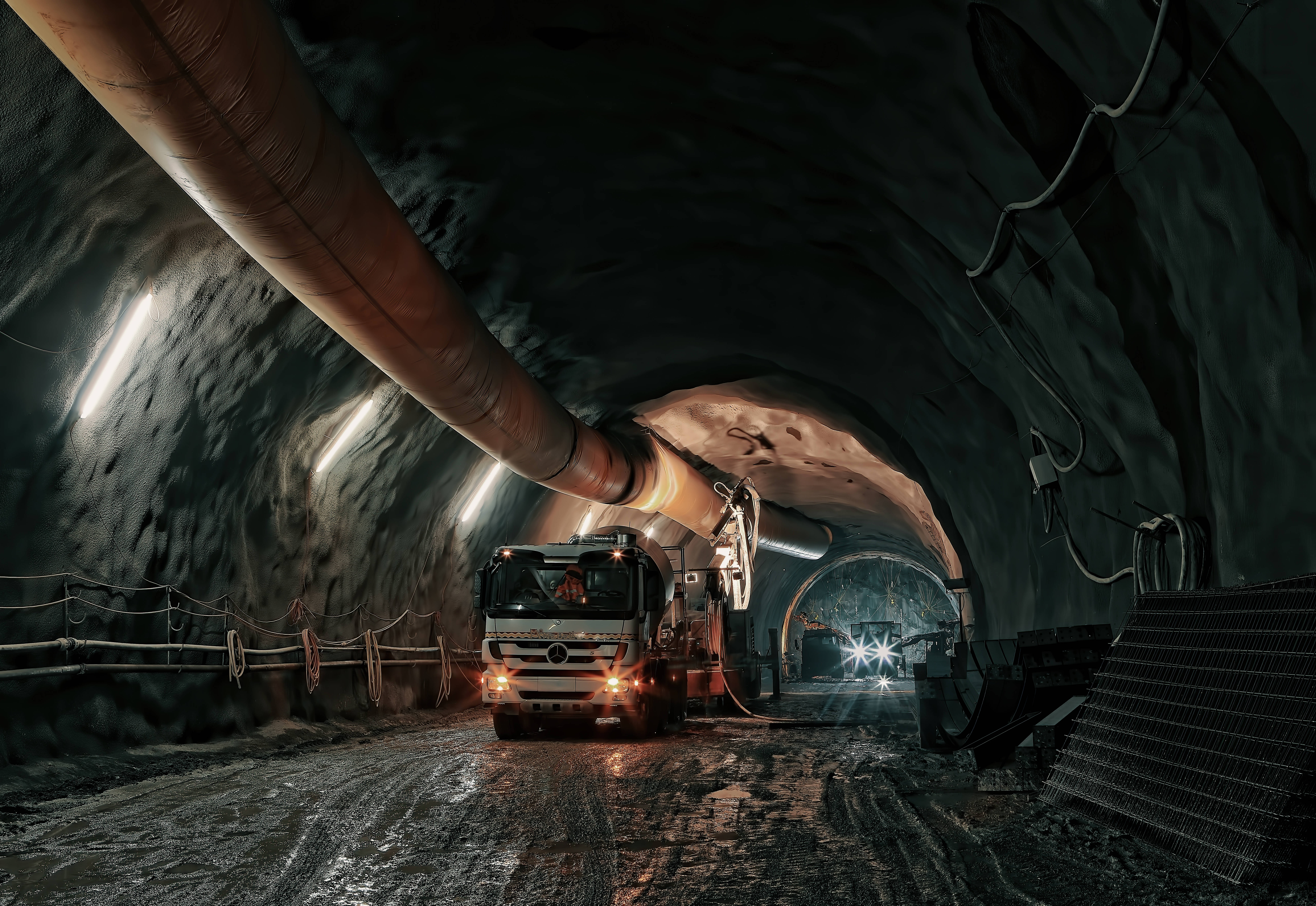 underground mining, heavy-duty mining truck, dimly lit underground tunnel, 8K Desktop Wallpaper