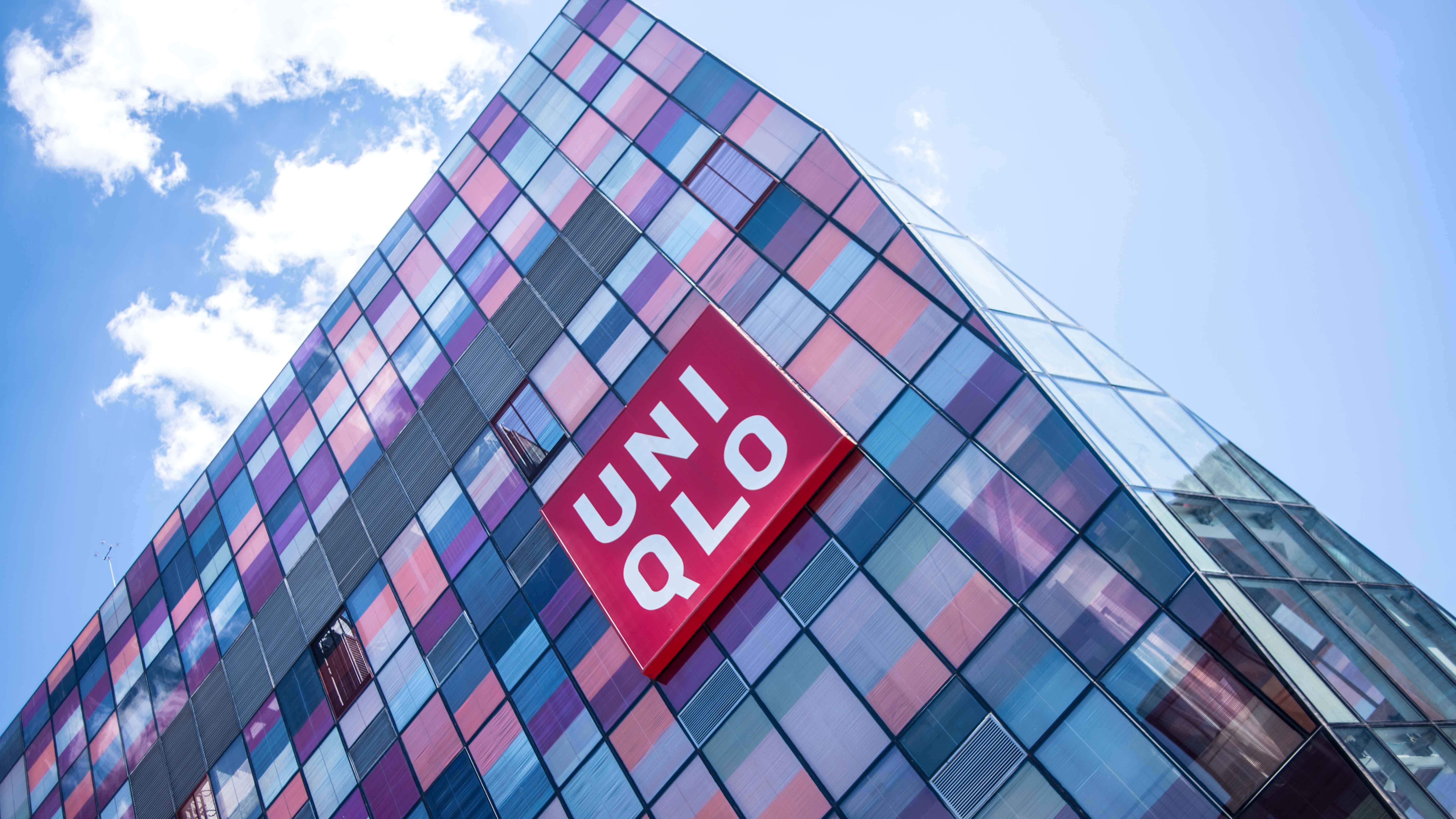 Uniqlo, colorful glass facade, bright blue sky, 5K Desktop Wallpaper