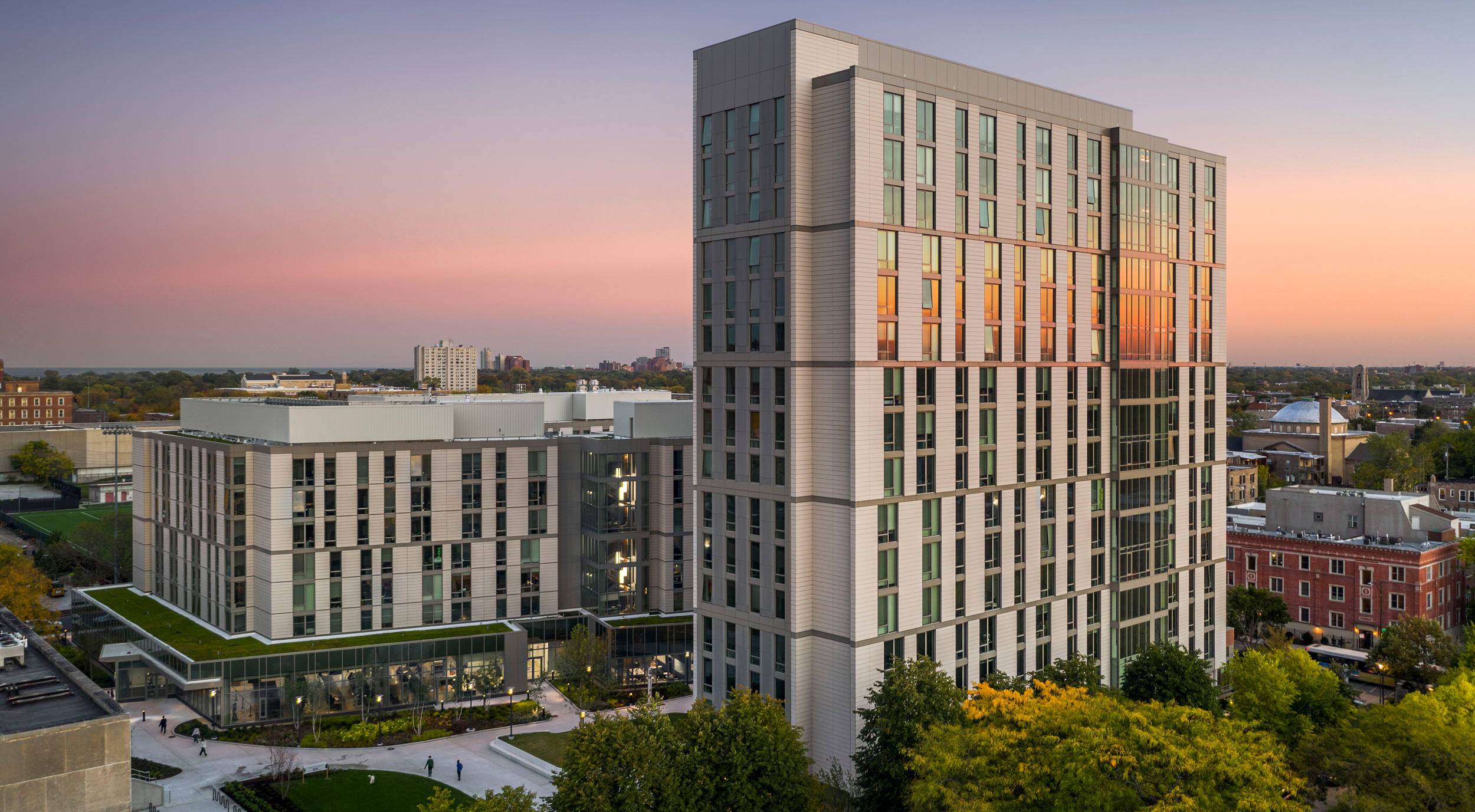 University Of Chicago, modern glass and steel apartment towers, soft pink and orange sunset sky, Full HD Desktop Wallpaper