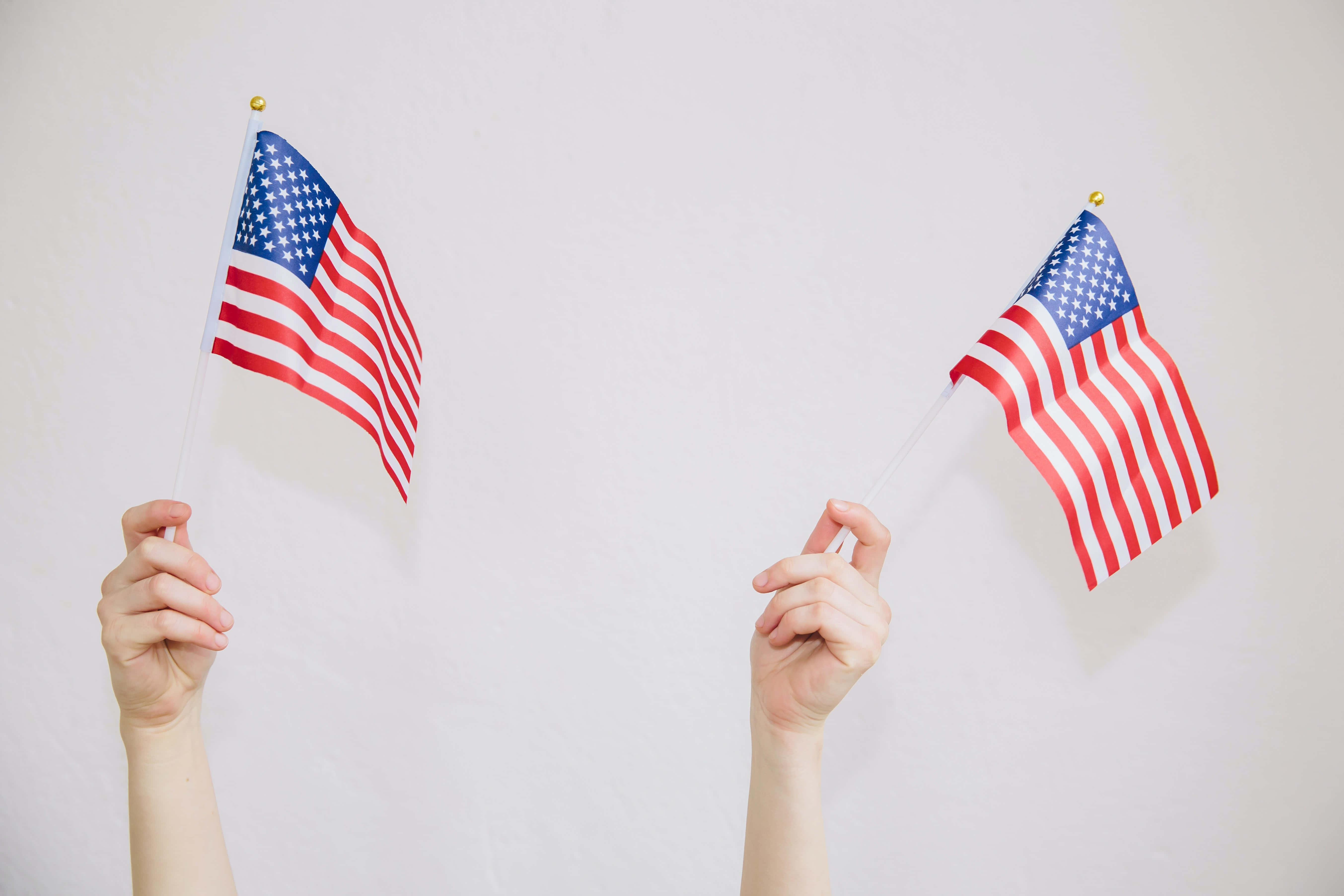 U.S. Flag, waving in the wind, two hands, 5K Desktop Wallpaper