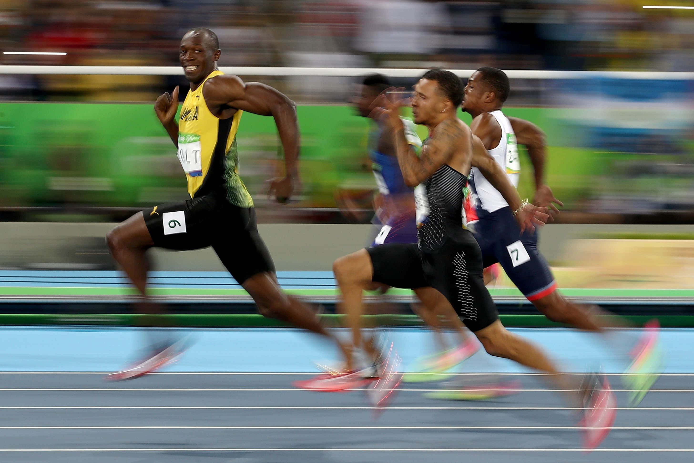 Usain Bolt, yellow and black gear, blue track, 2K Desktop Wallpaper