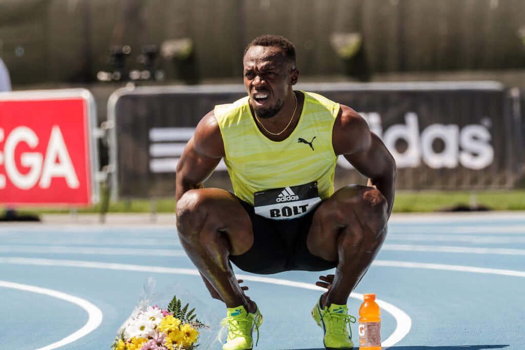 Usain Bolt, blue track, bright yellow tank top, SD Desktop Wallpaper