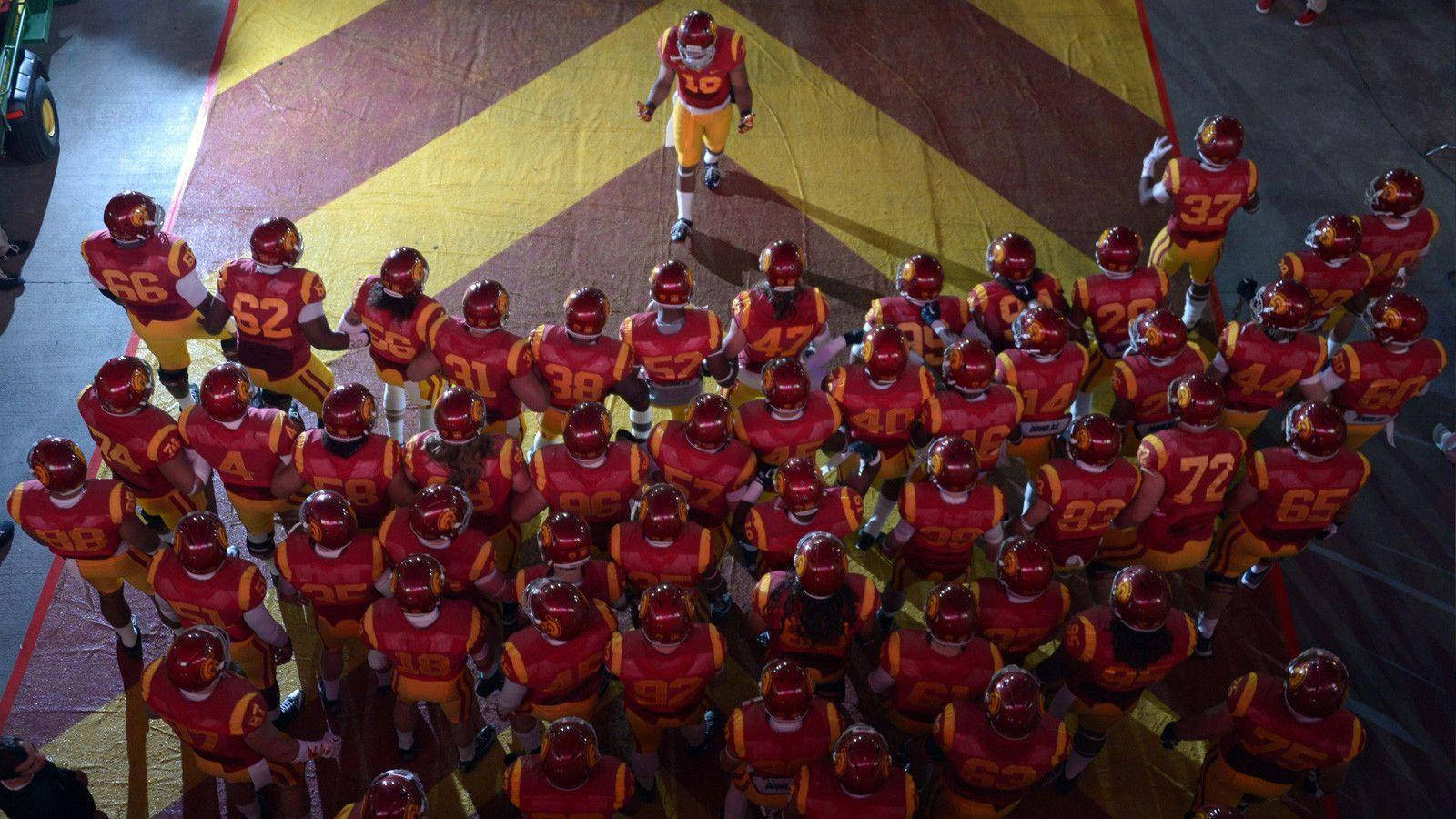 USC Football, red and gold uniforms, patterned field, HD Desktop Wallpaper