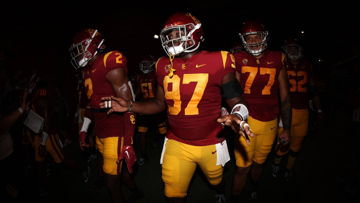 USC Football, maroon and gold uniforms, stadium lights, SD Desktop Wallpaper
