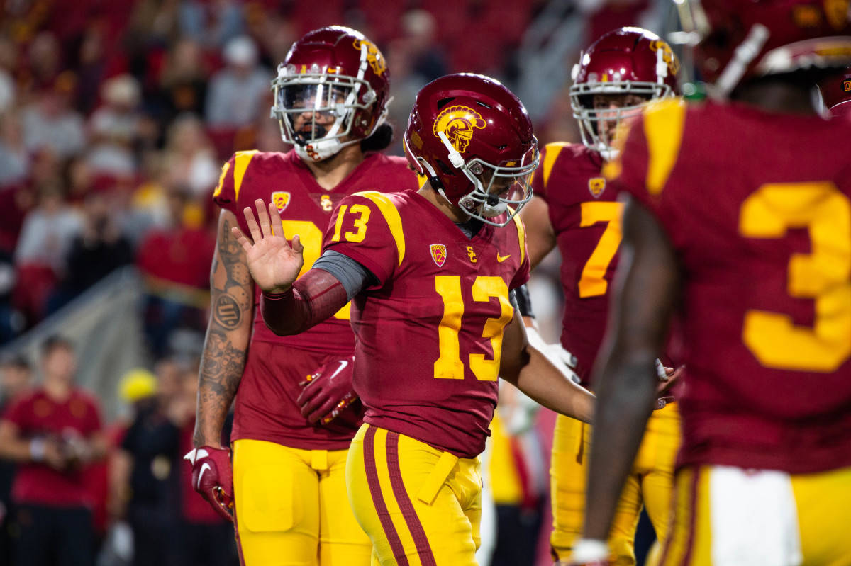 USC Football, maroon and gold uniforms, lit field, SD Desktop Wallpaper
