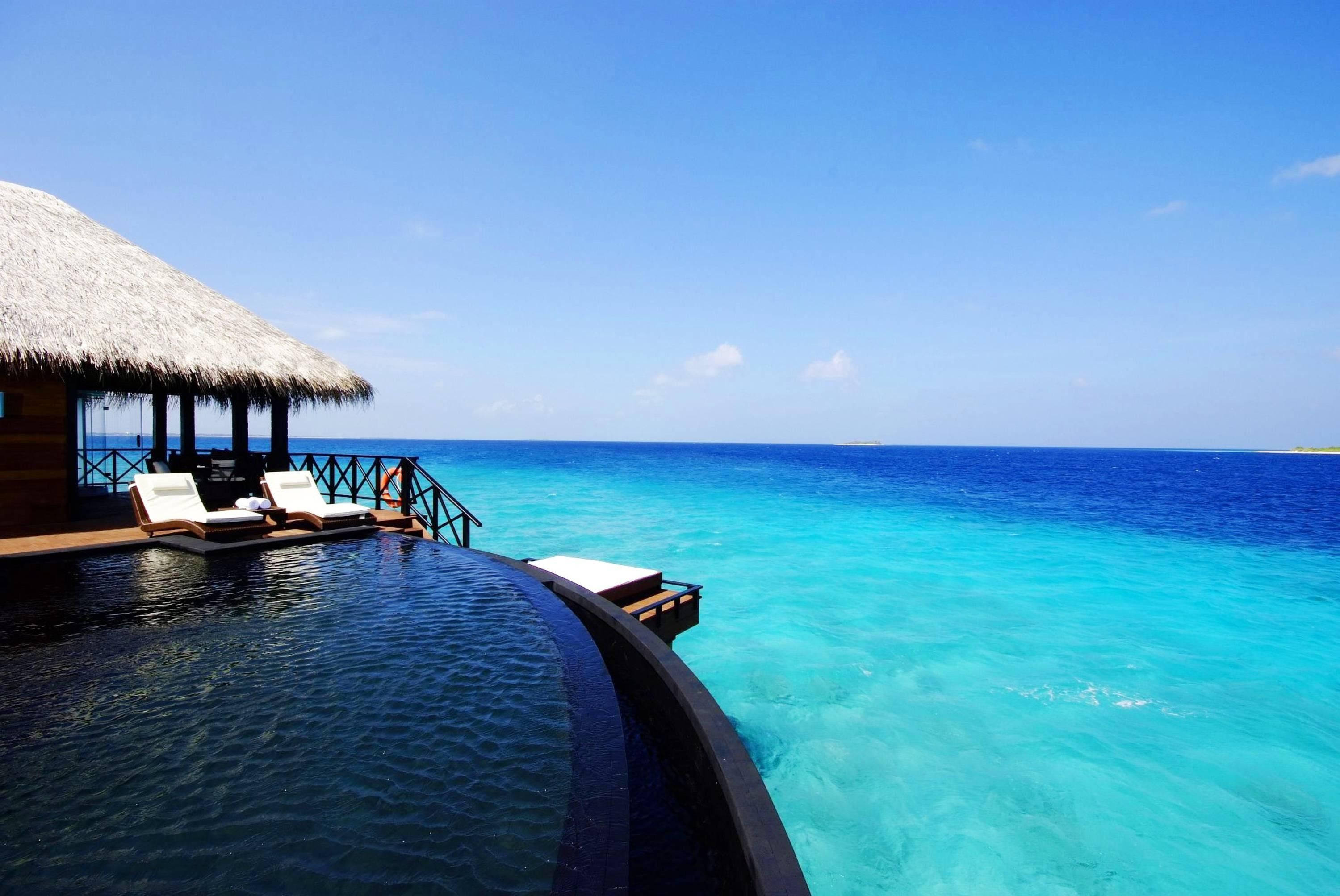 overwater villa, private infinity pool, turquoise waters, 2K Desktop Wallpaper