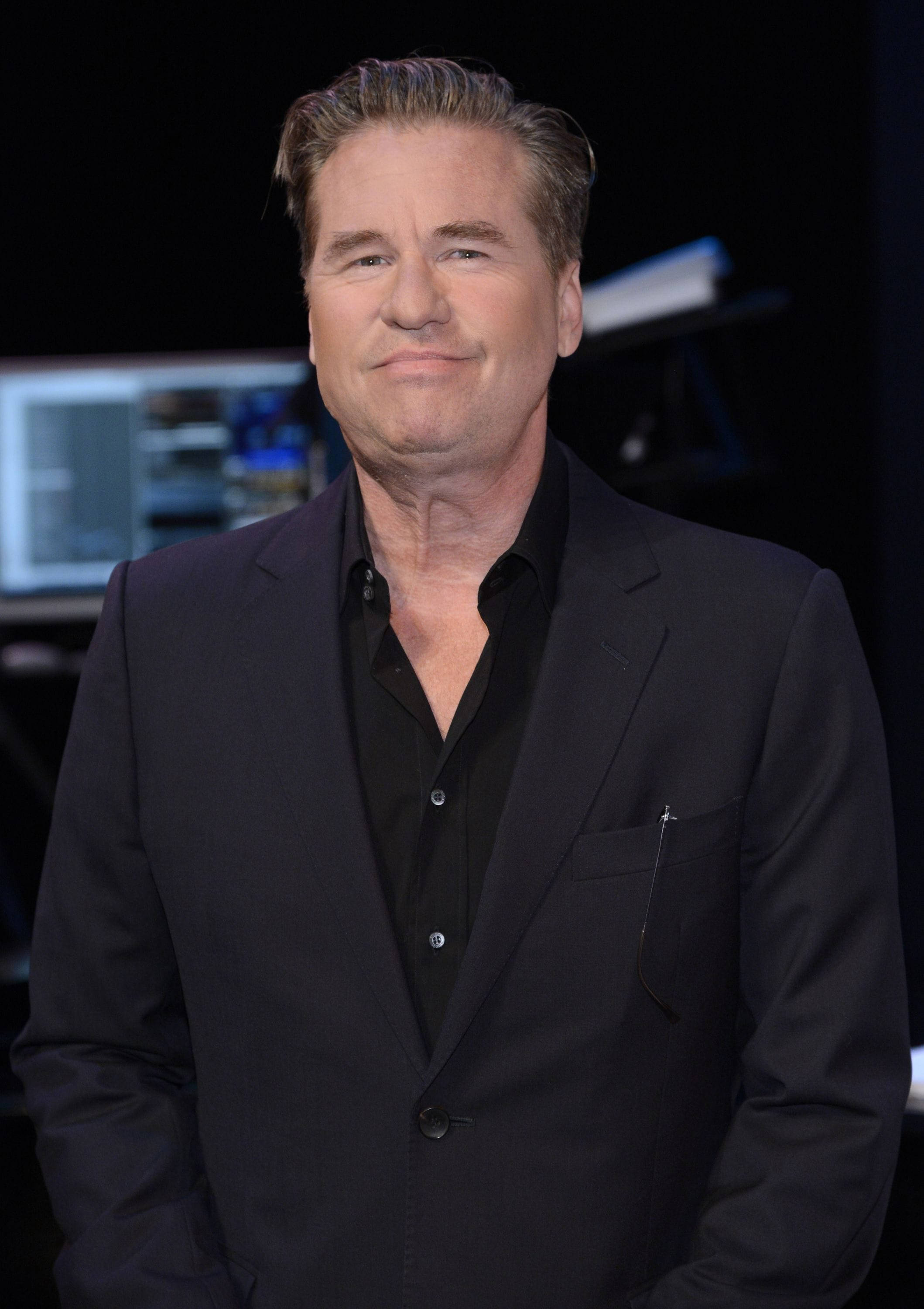 Val Kilmer, black suit, dark studio backdrop, 2K Phone Wallpaper