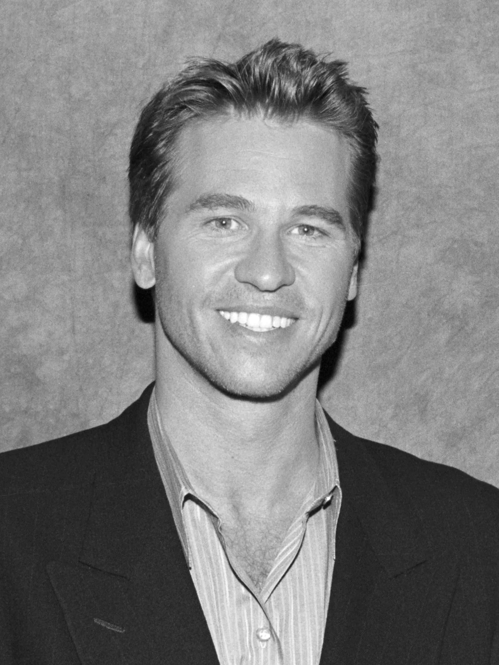 Val Kilmer, smiling portrait, black and white, 2K Phone Wallpaper