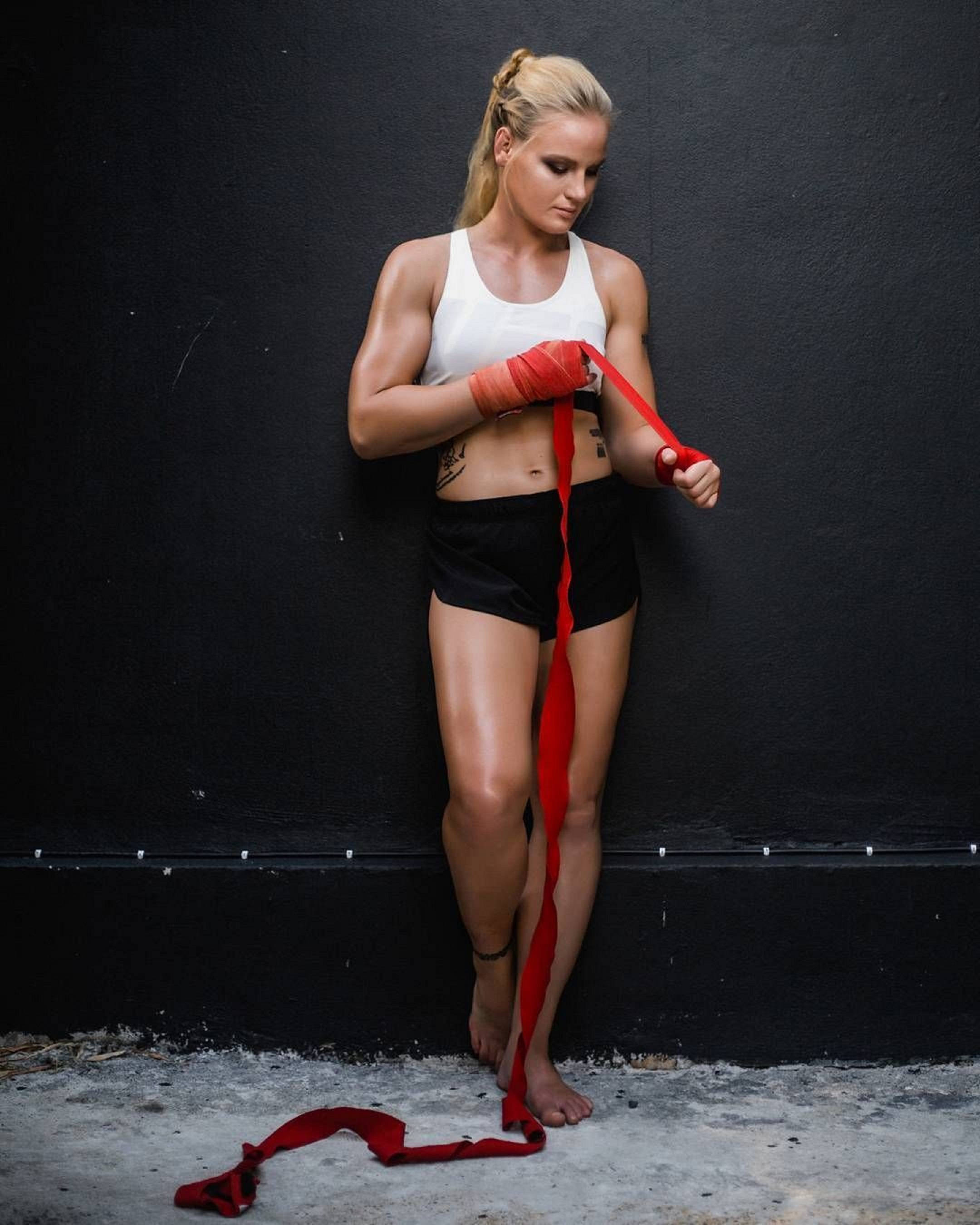Valentina Shevchenko, white tank top, black shorts, 2K Phone Wallpaper