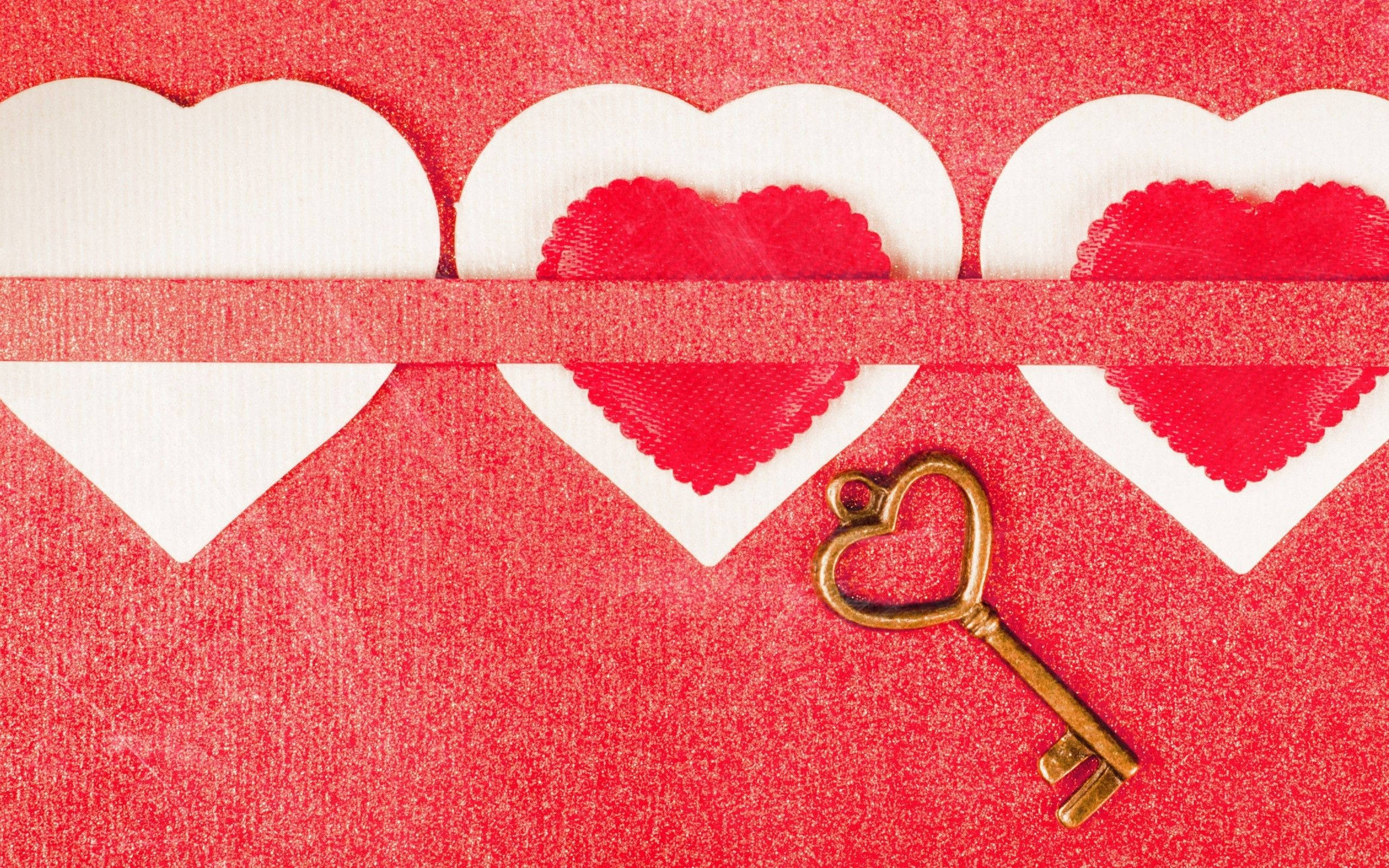 golden heart-shaped key, textured red surface, white paper hearts, 2K Desktop Wallpaper