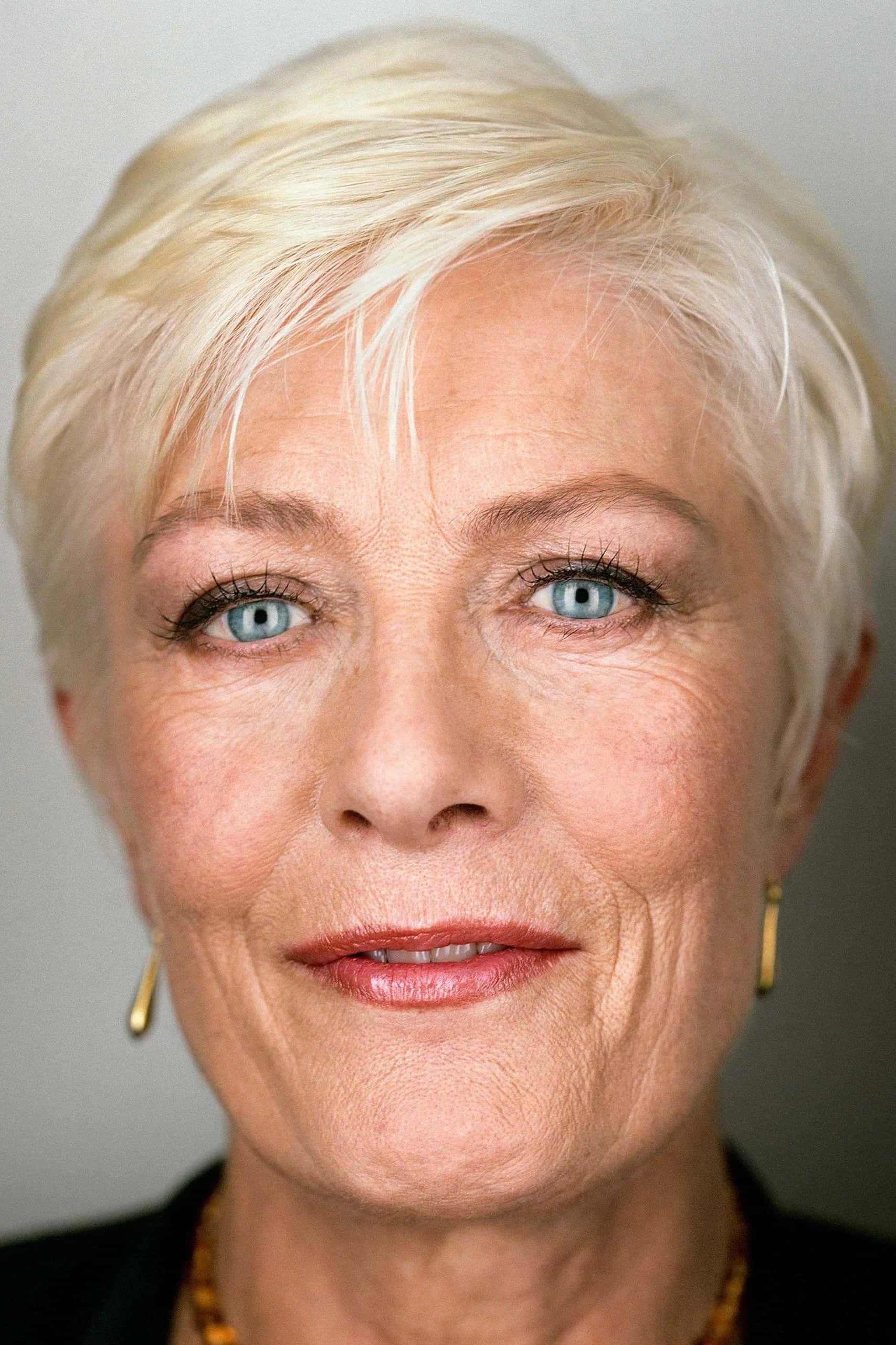 Vanessa Redgrave, platinum blonde hair, striking blue eyes, 2K Phone Wallpaper
