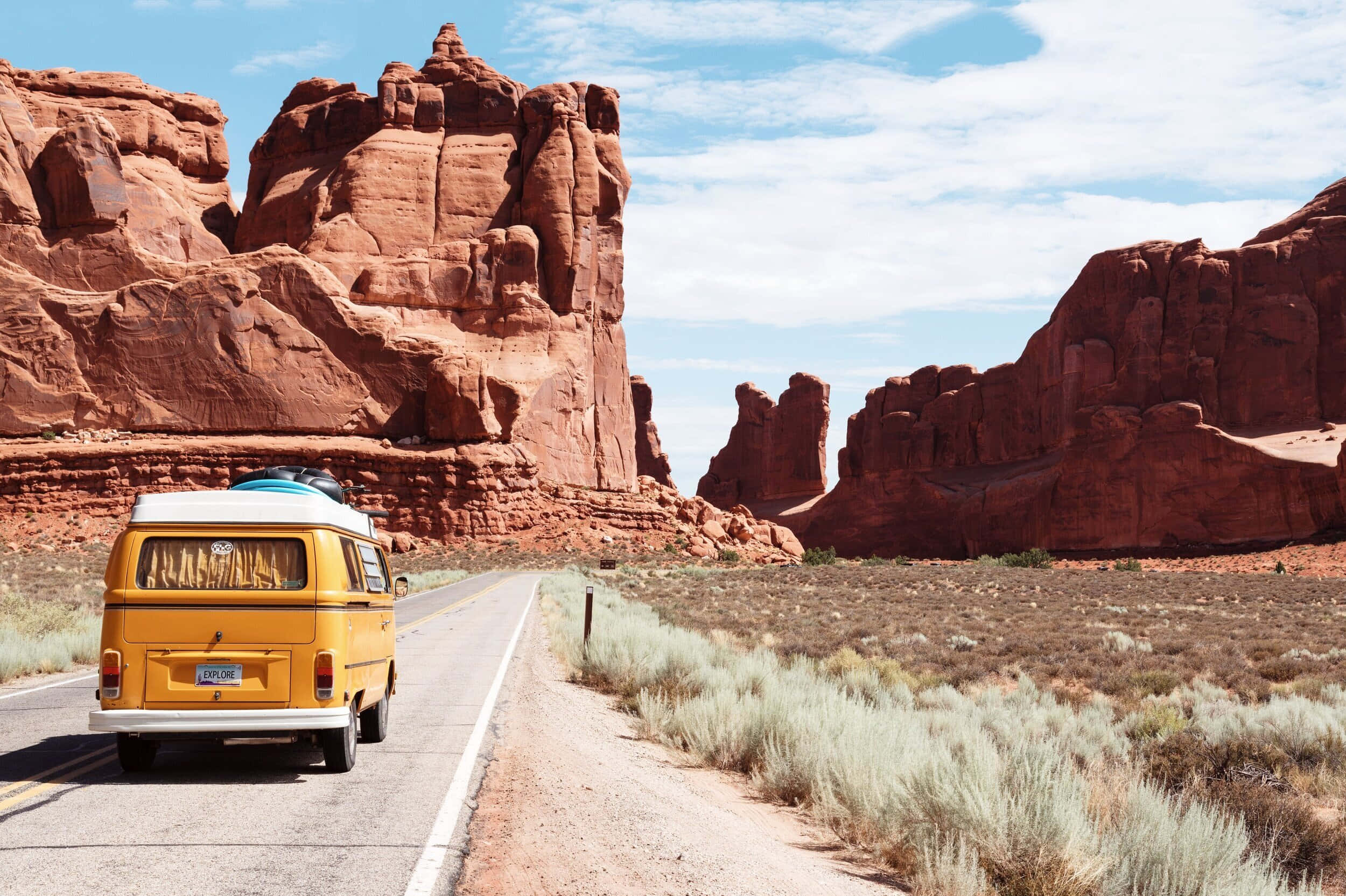 vintage yellow van, desert road, towering red rock formations, Full HD Desktop Wallpaper