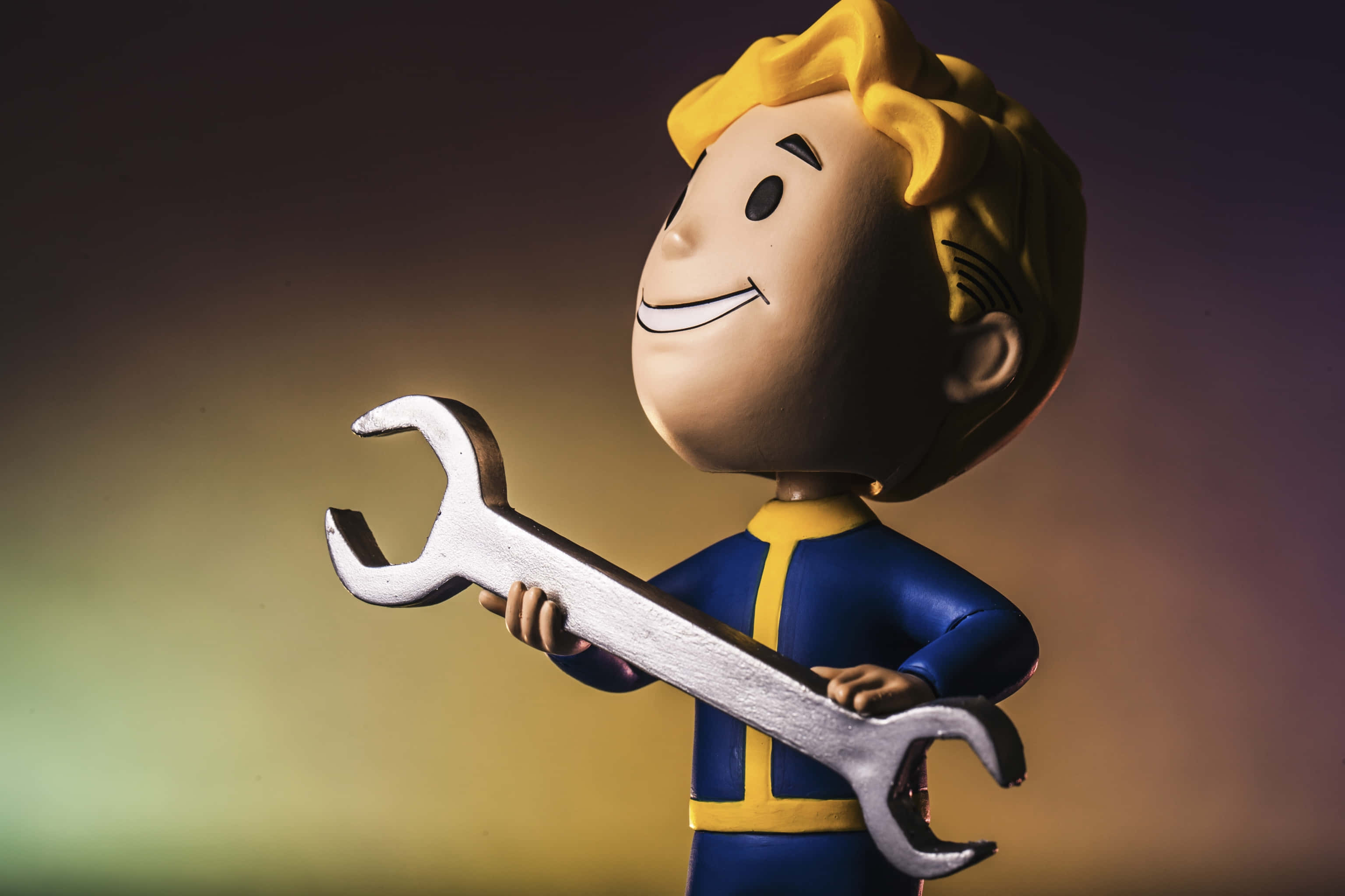 Vault Boy, blue and yellow jumpsuit, silver wrench, 2K Desktop Wallpaper