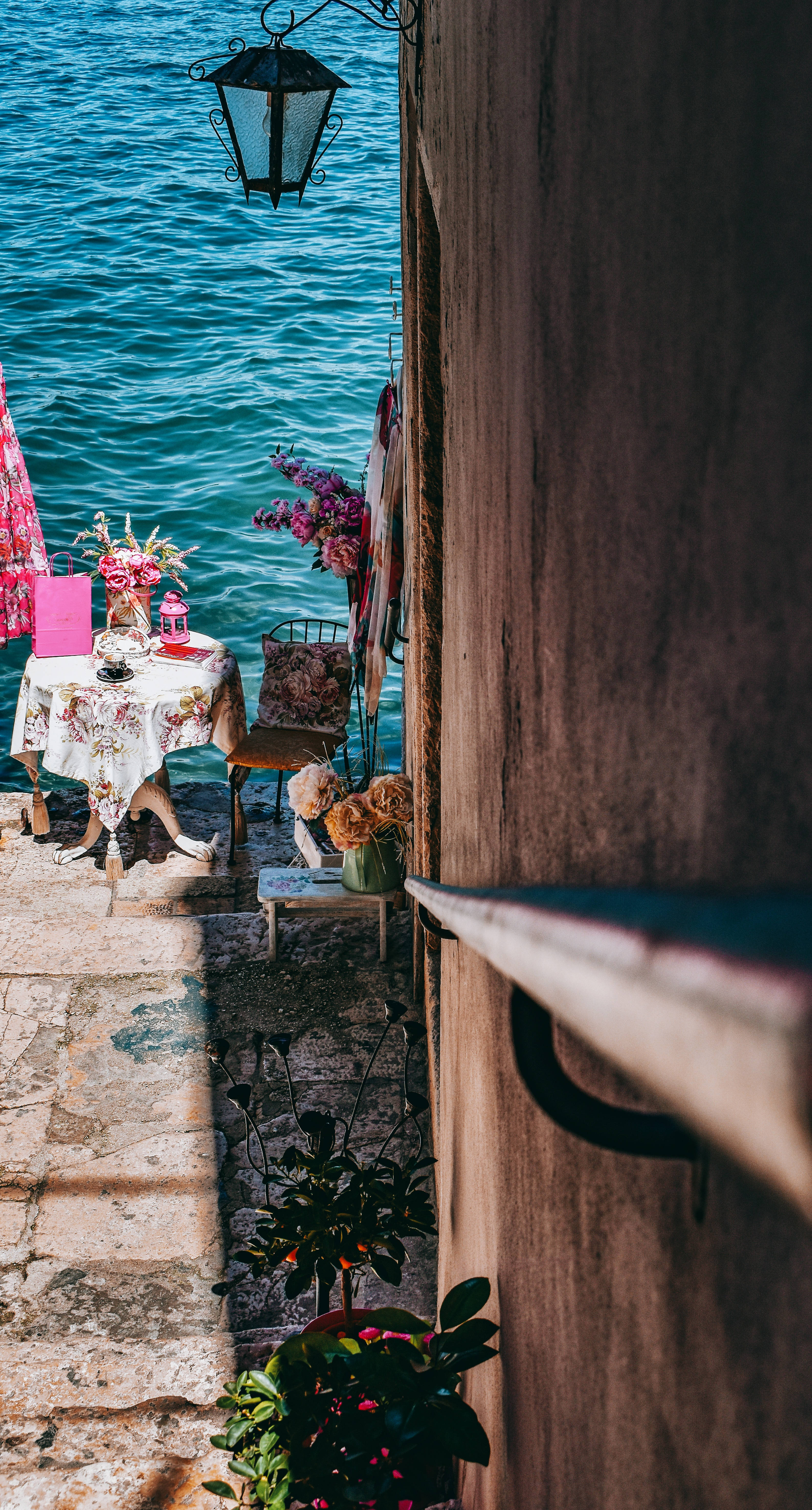 blue velvet waters, seaside cafe, floral table set, 5K Phone Wallpaper