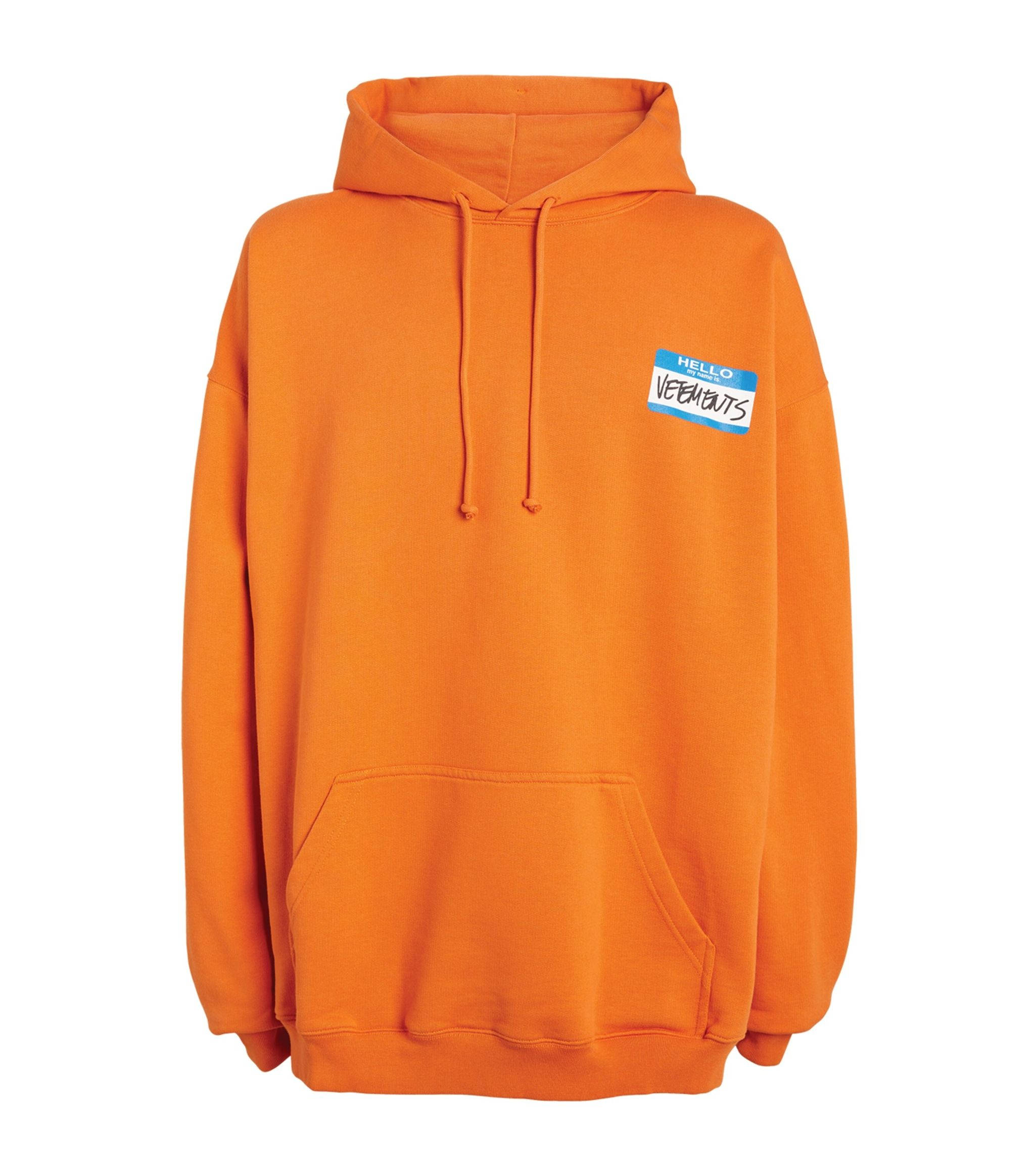 Vetements, orange hoodie, blue and white name tag, Full HD Phone Wallpaper