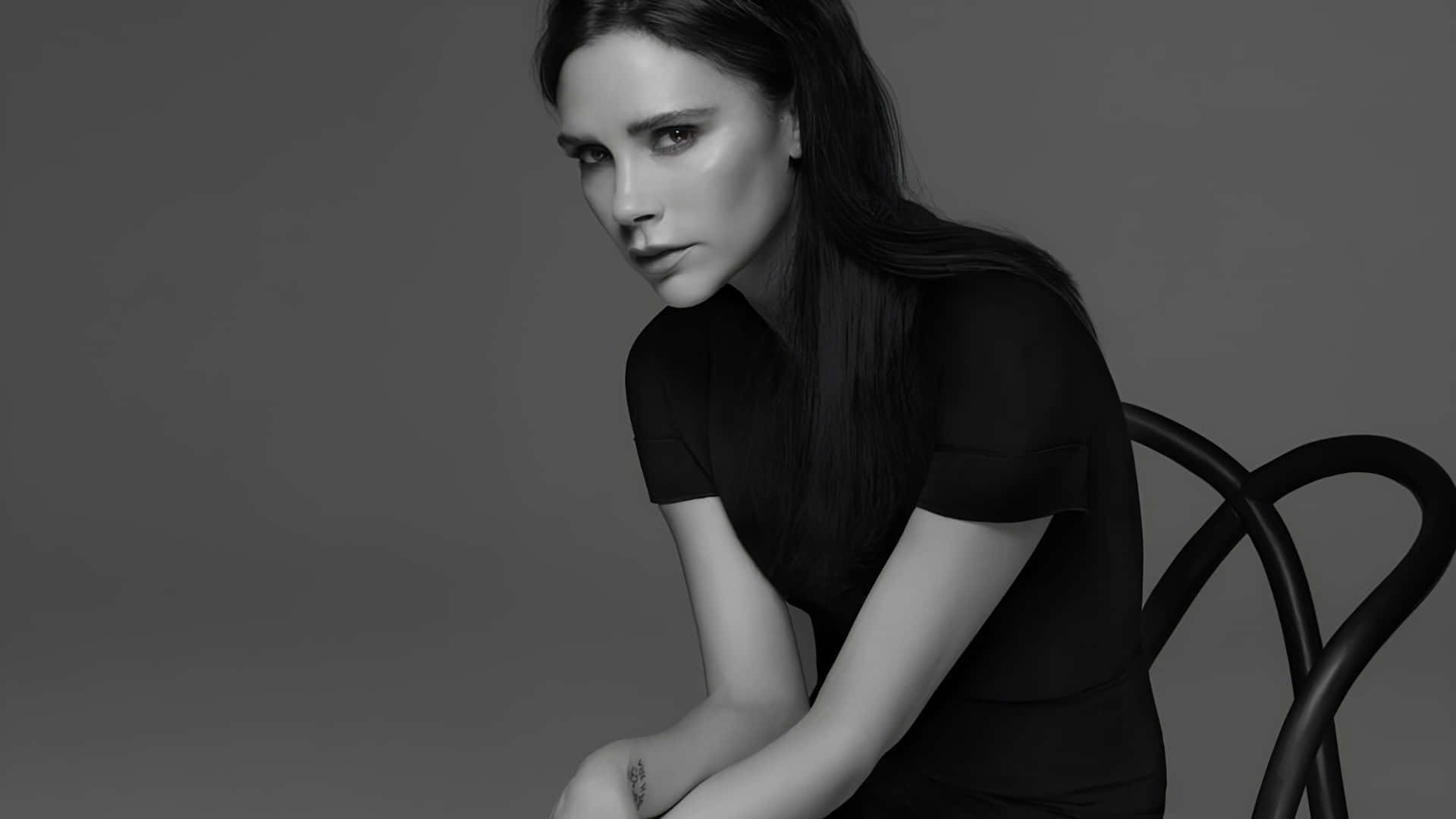 Victoria Beckham, elegant black dress, black chair, Full HD Desktop Wallpaper