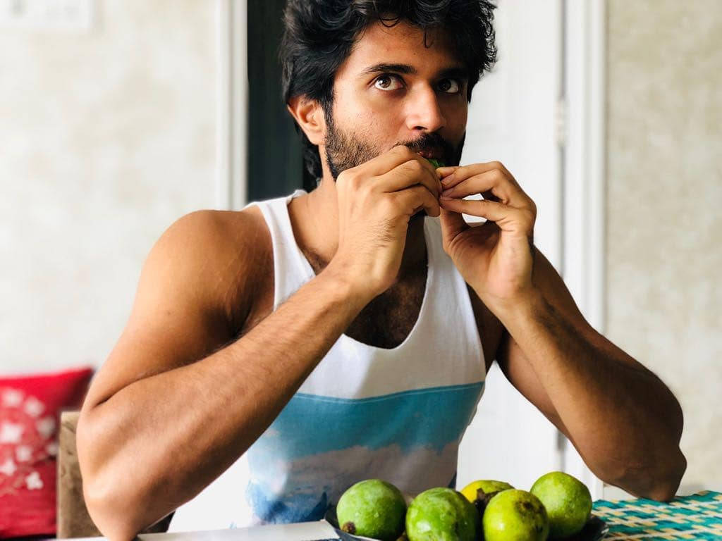 Vijay Devarakonda, eating guava, white tank top, SD Desktop Wallpaper