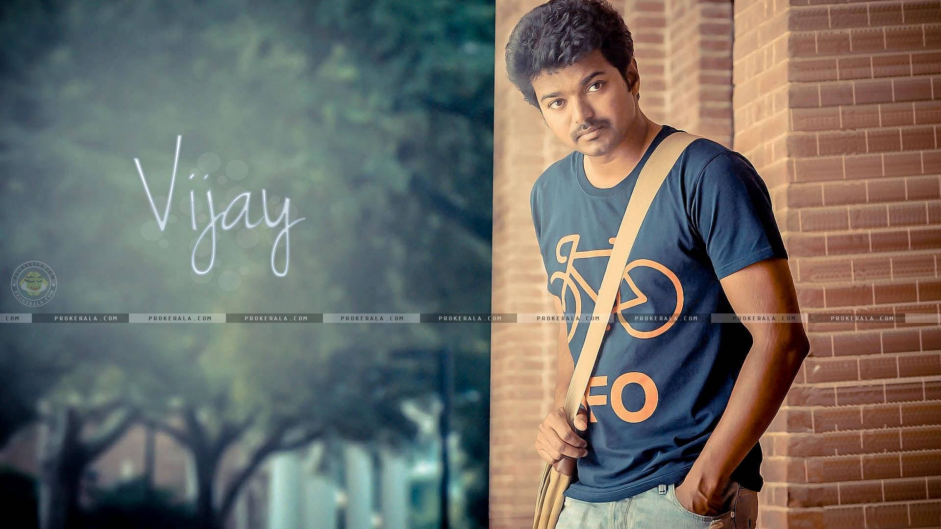 Vijay HD, blue bike-themed t-shirt, brick wall, Full HD Desktop Wallpaper
