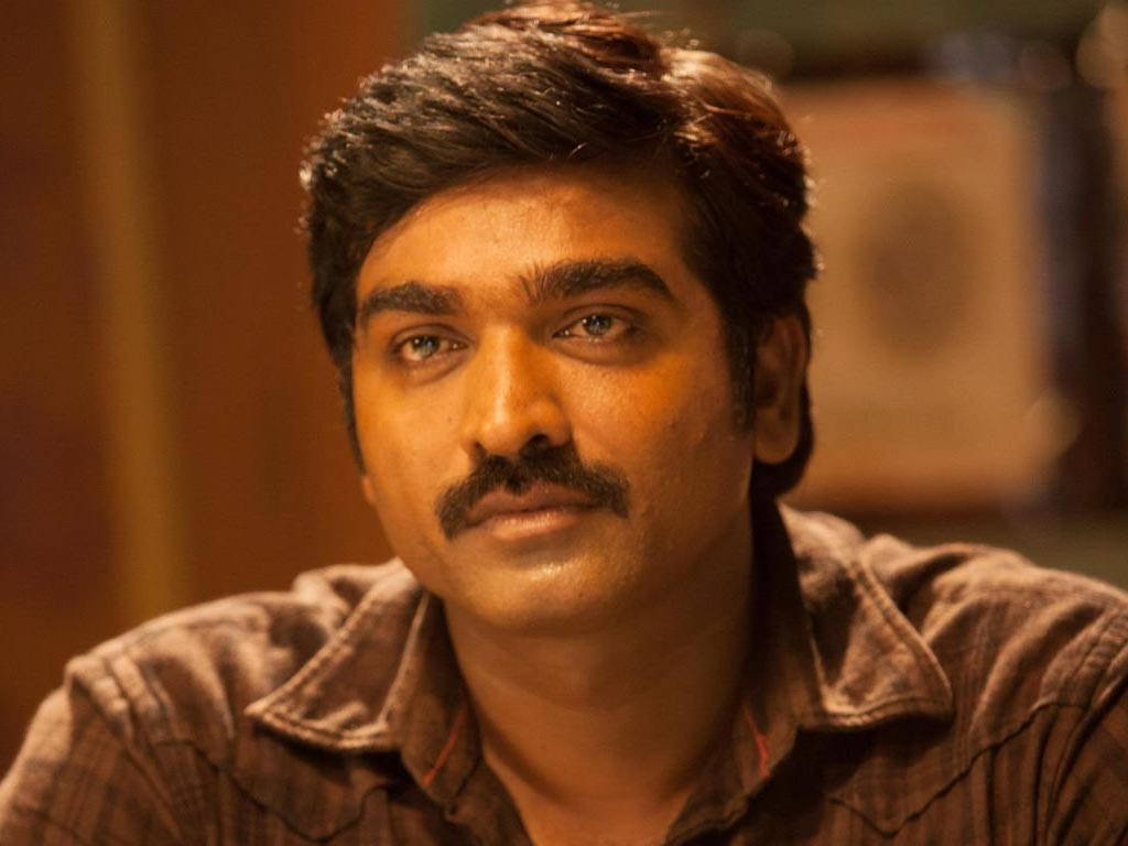 Vijay Sethupathi, yellow lighting, warmly lit indoor setting, SD Desktop Wallpaper