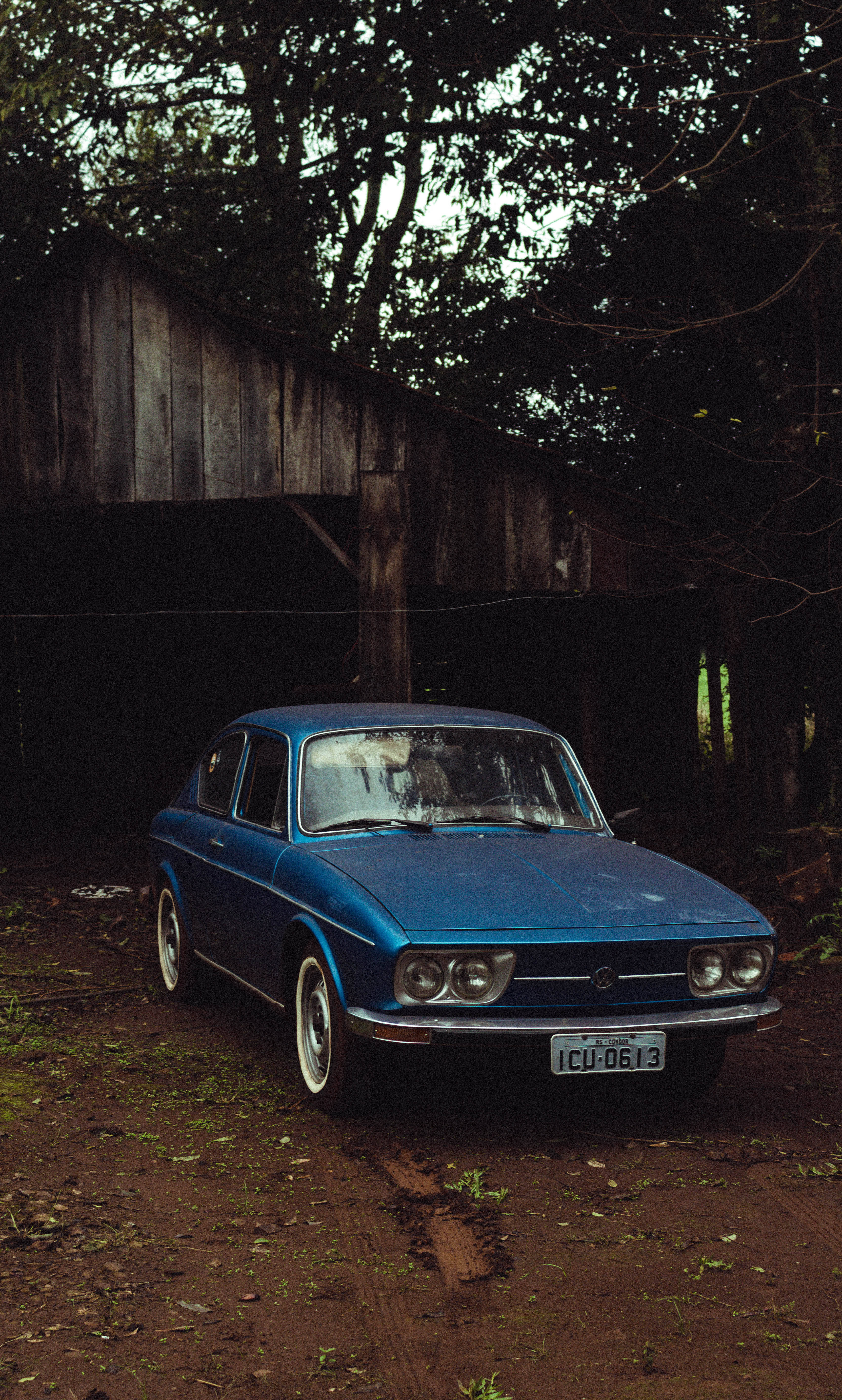 vintage 90s blue car aesthetic, blue car, muddy path, 5K Phone Wallpaper