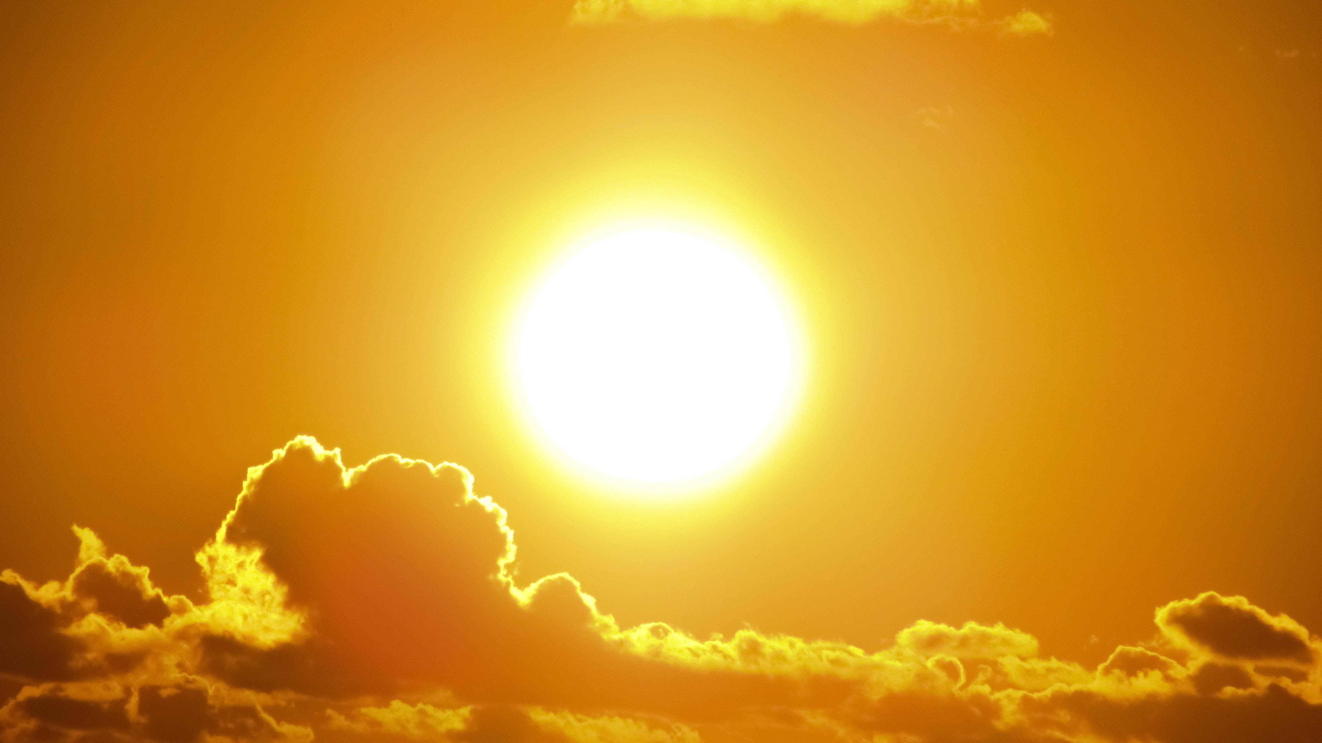 Vintage Aesthetic Clouds, bright sun, golden-orange skies, 4K Desktop Wallpaper