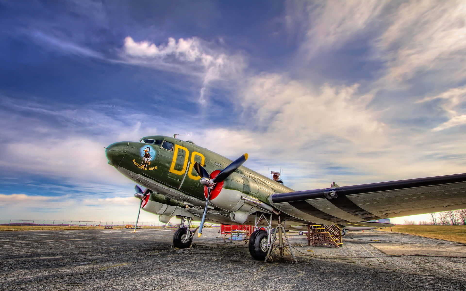 olive-drab military transport plane, yellow 'DC' markings, tarmac, Full HD Desktop Wallpaper