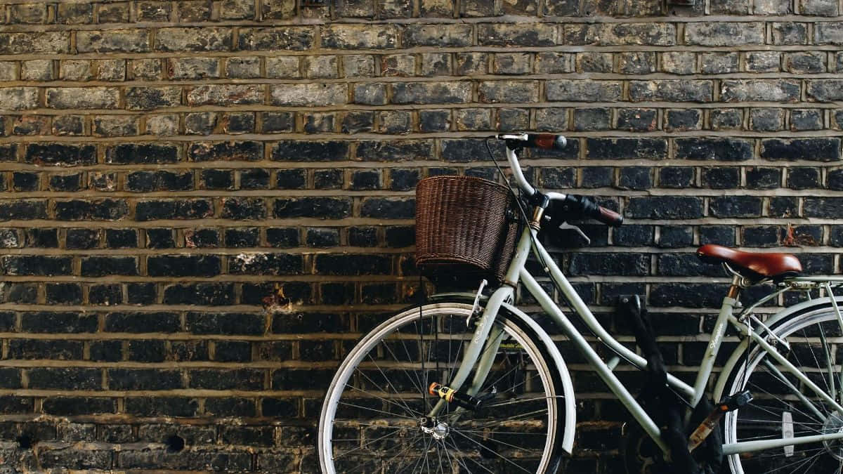 vintage bicycle, wicker basket, weathered dark brick wall, SD Desktop Wallpaper