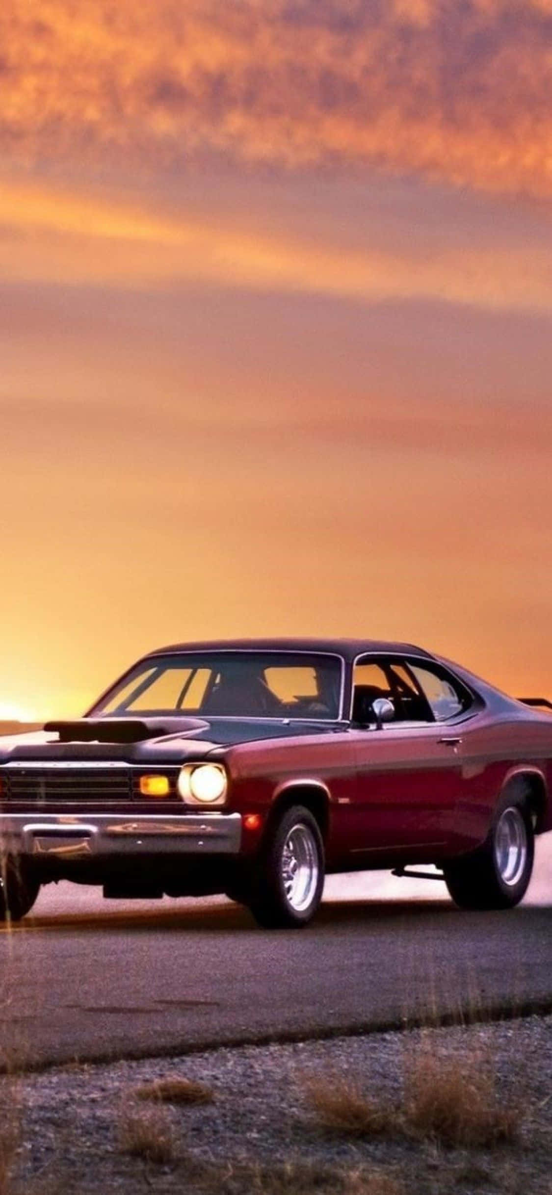 red muscle car, gravel roadside, fiery orange sunset sky, Full HD Phone Wallpaper