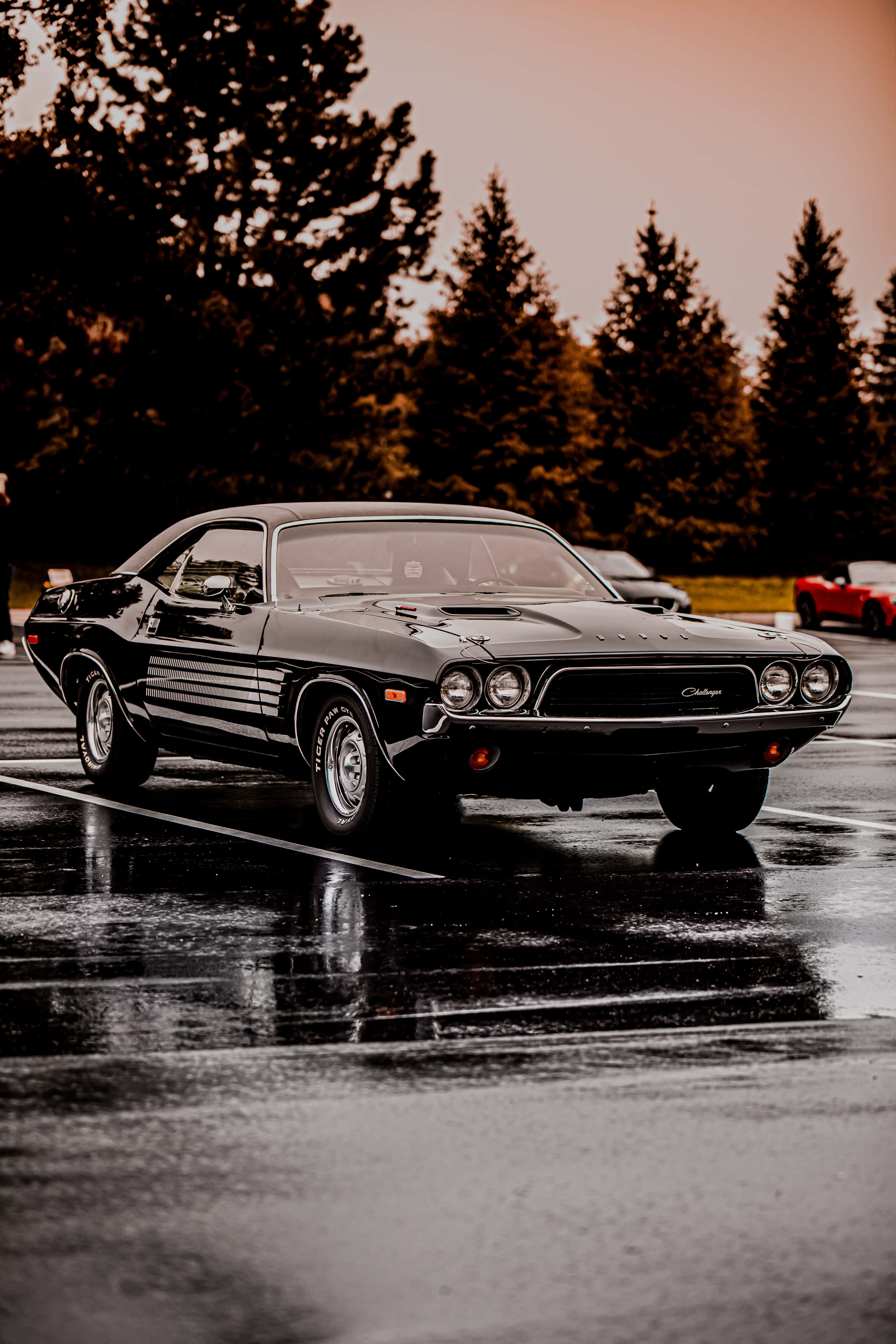 Black Vintage Car iPhone, sleek black classic muscle car, wet parking lot, 5K Phone Wallpaper
