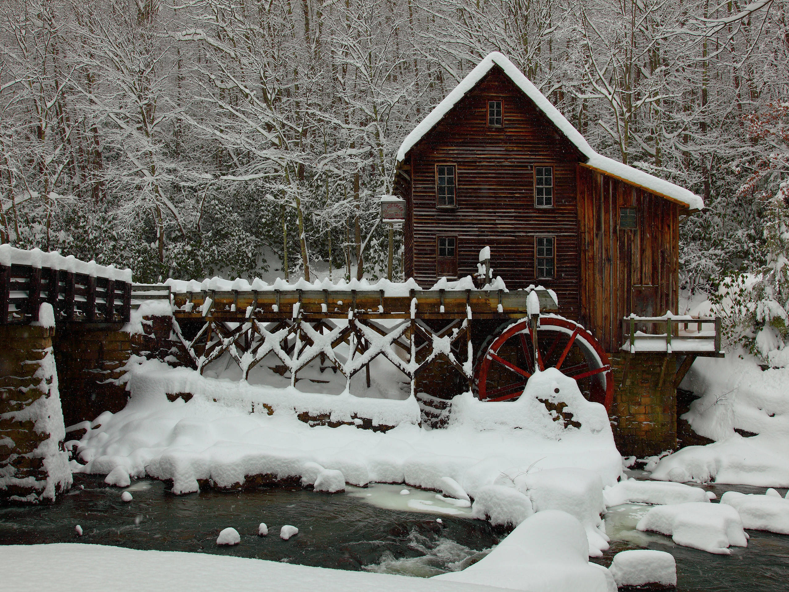 old aesthetic christmas mill, snow-covered wooden watermill, red wheel, 2K Desktop Wallpaper