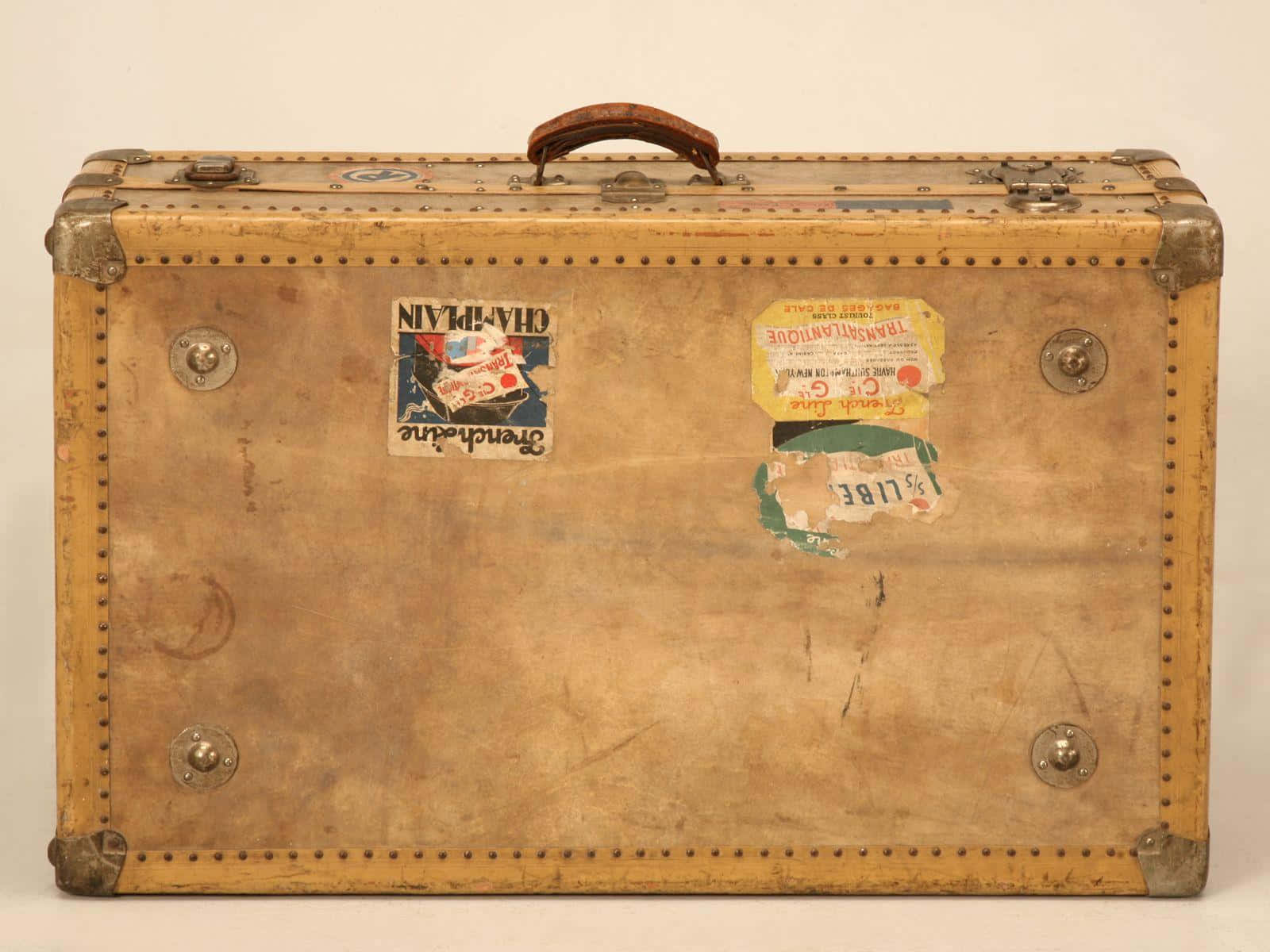 vintage leather suitcase, brass corners, faded travel stickers, HD Desktop Wallpaper