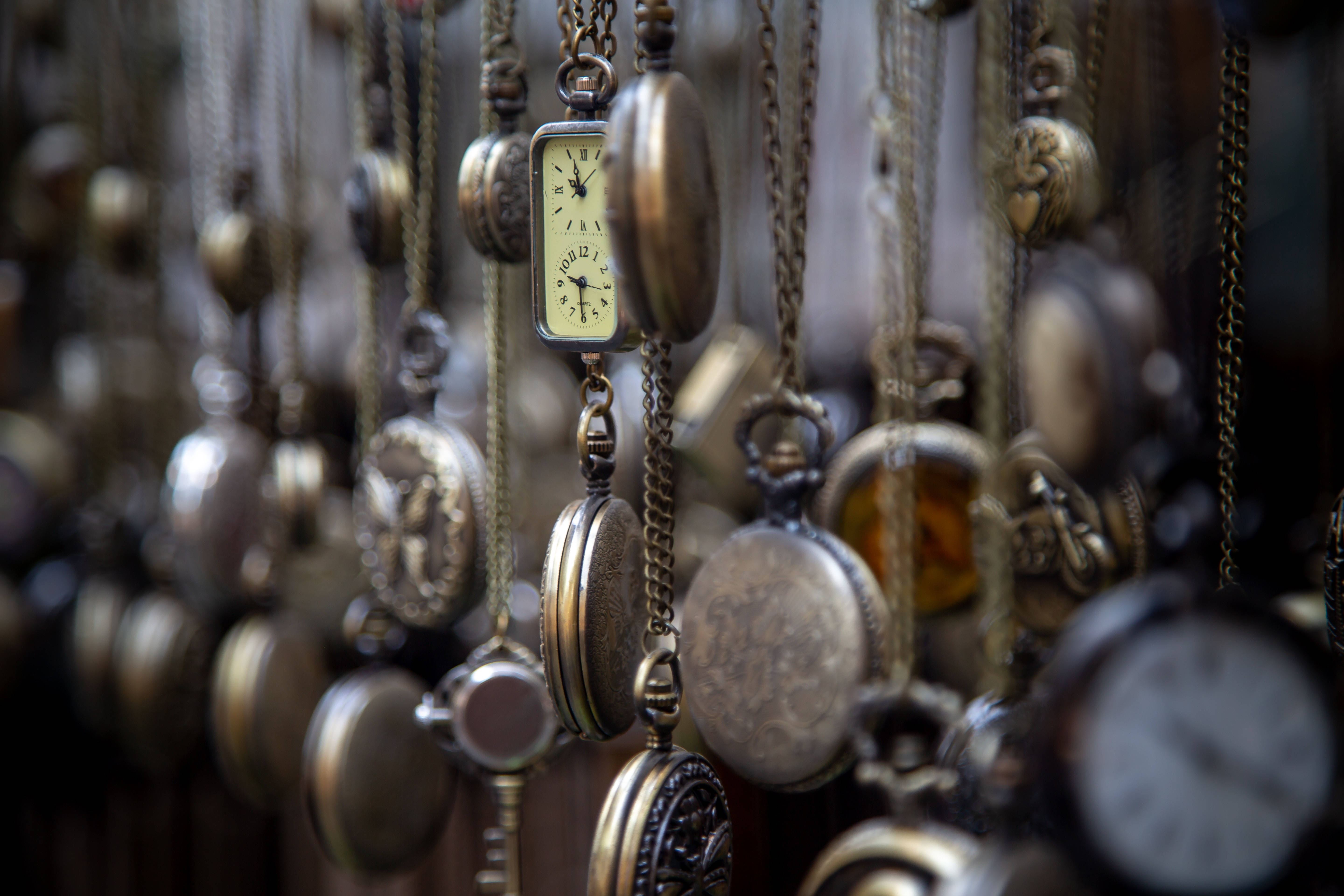 vintage pocket watches, rectangular face, softly blurred background, 5K Desktop Wallpaper