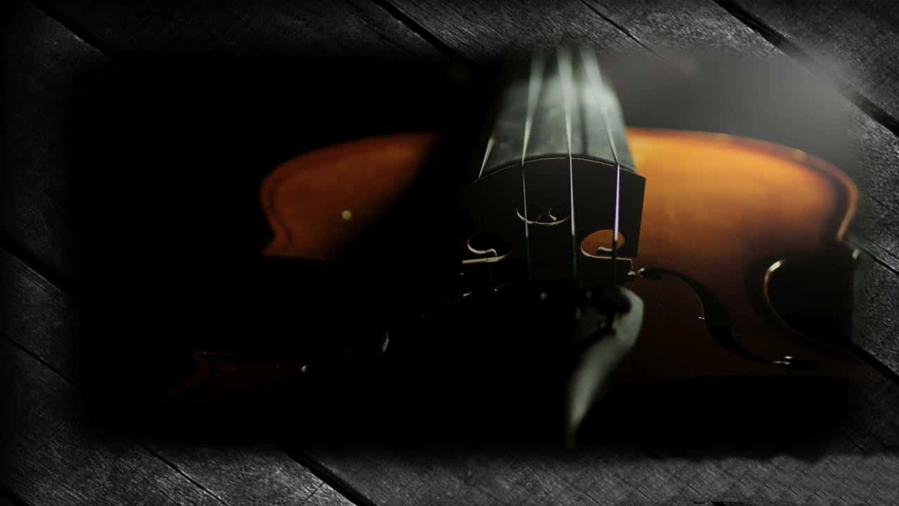 violin, dark wooden surface, dramatic lighting, HD Desktop Wallpaper
