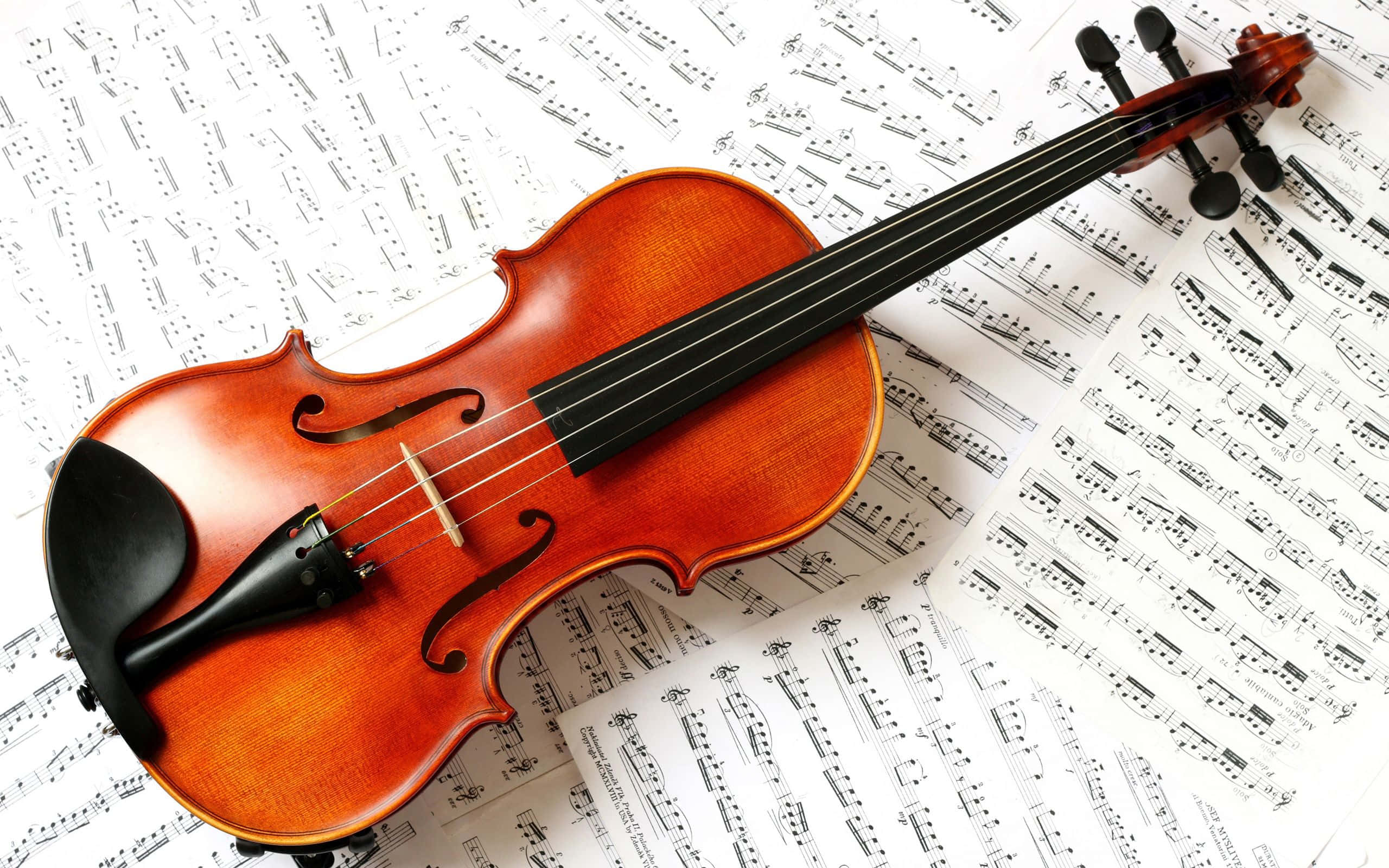wooden violin, musical notation, warm artistic composition, 2K Desktop Wallpaper