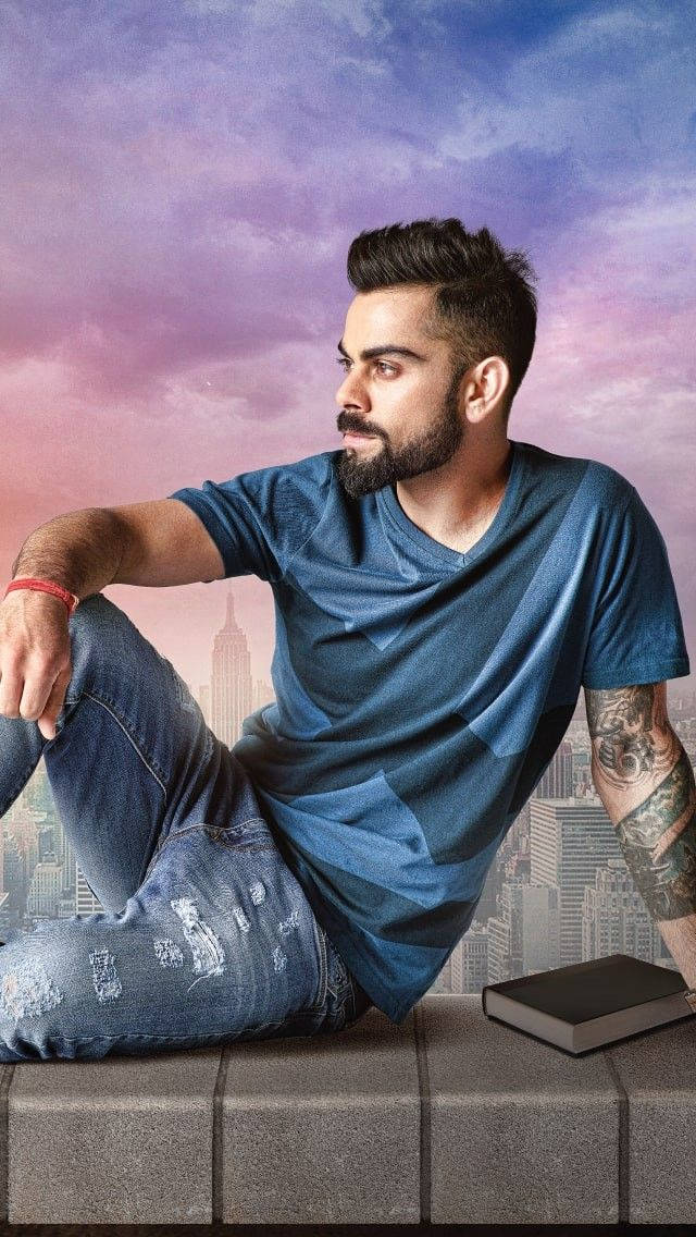 Virat Kohli, blue shirt, vibrant purple and pink city skyline, SD Phone Wallpaper