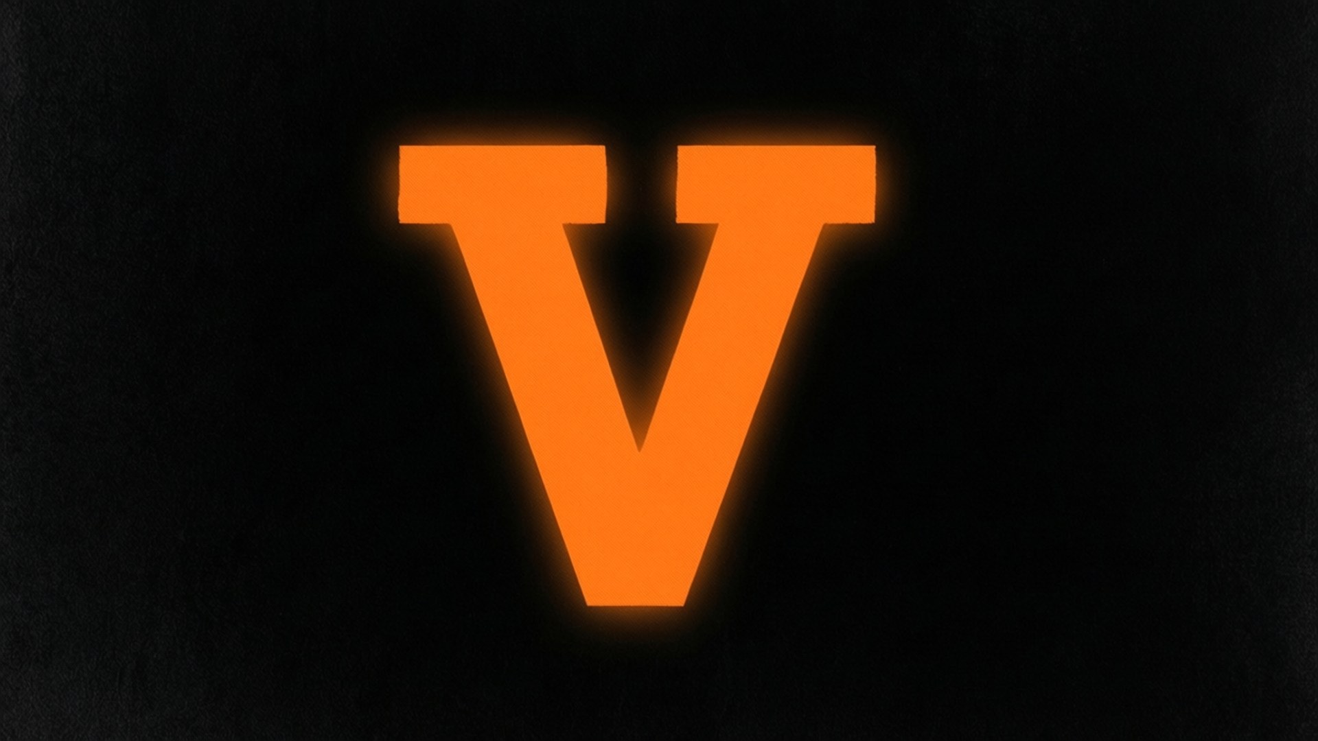 glowing orange letter V, textured black background, soft light bleed, Full HD Desktop Wallpaper