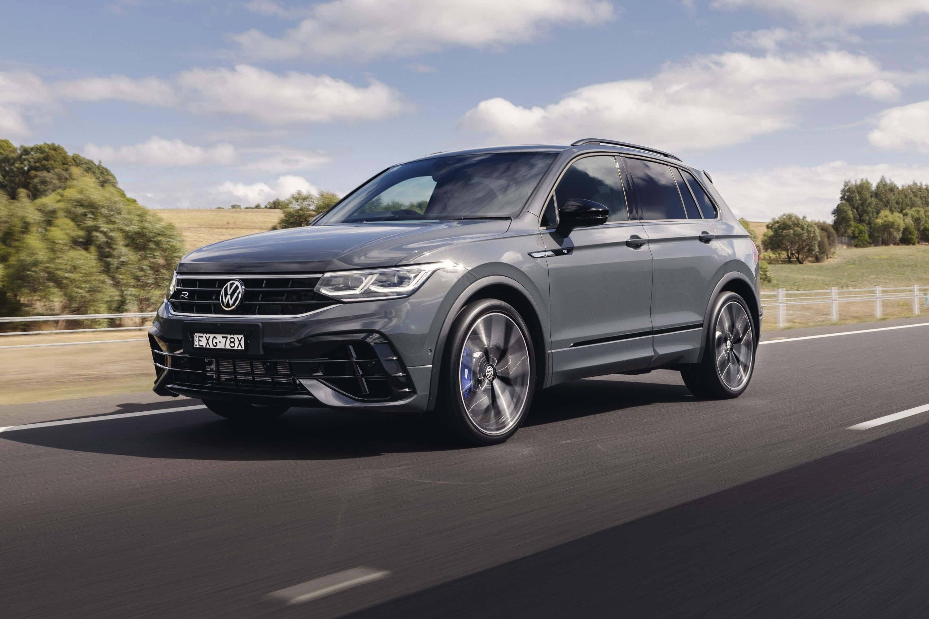 Volkswagen Tiguan R, sleek gray, sunlit rural road, 2K Desktop Wallpaper
