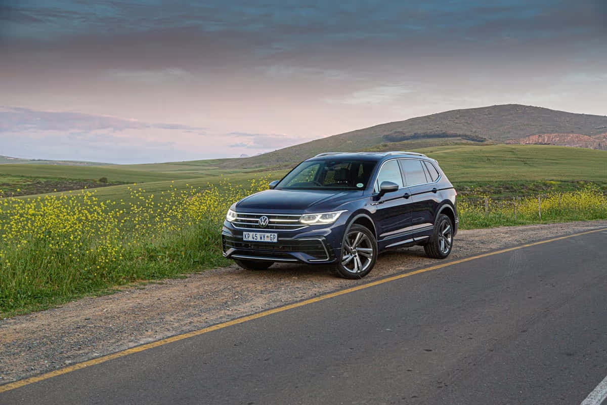 Volkswagen Tiguan, dark blue, rolling green hills, SD Desktop Wallpaper