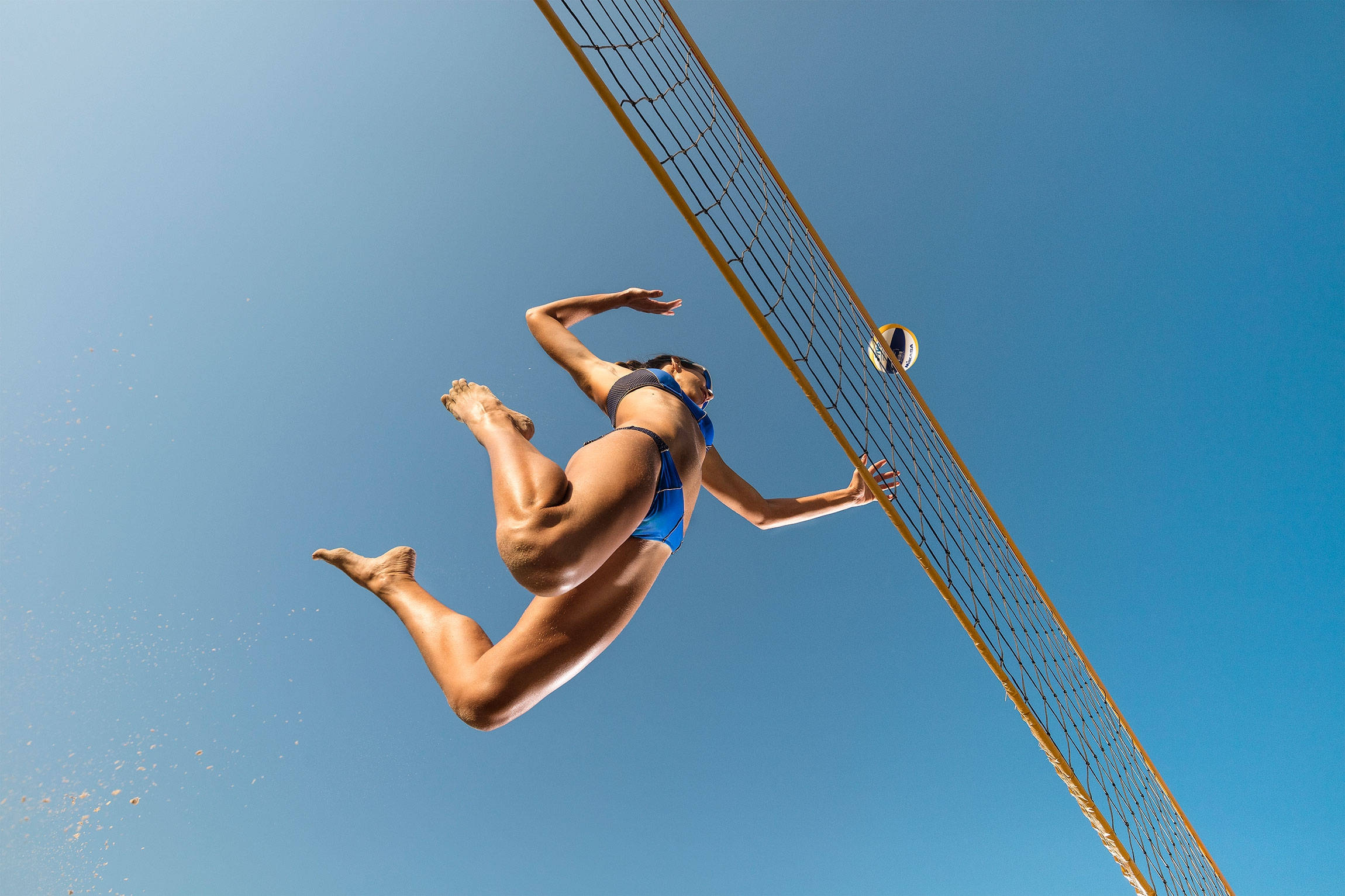 girl spiking midair volleyball, clear blue sky, leaps dynamically, Full HD Desktop Wallpaper