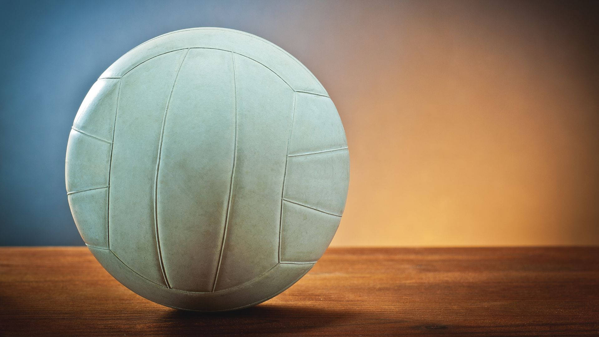 vintage white volleyball, wooden surface, gradient blue and orange backdrop, Full HD Desktop Wallpaper
