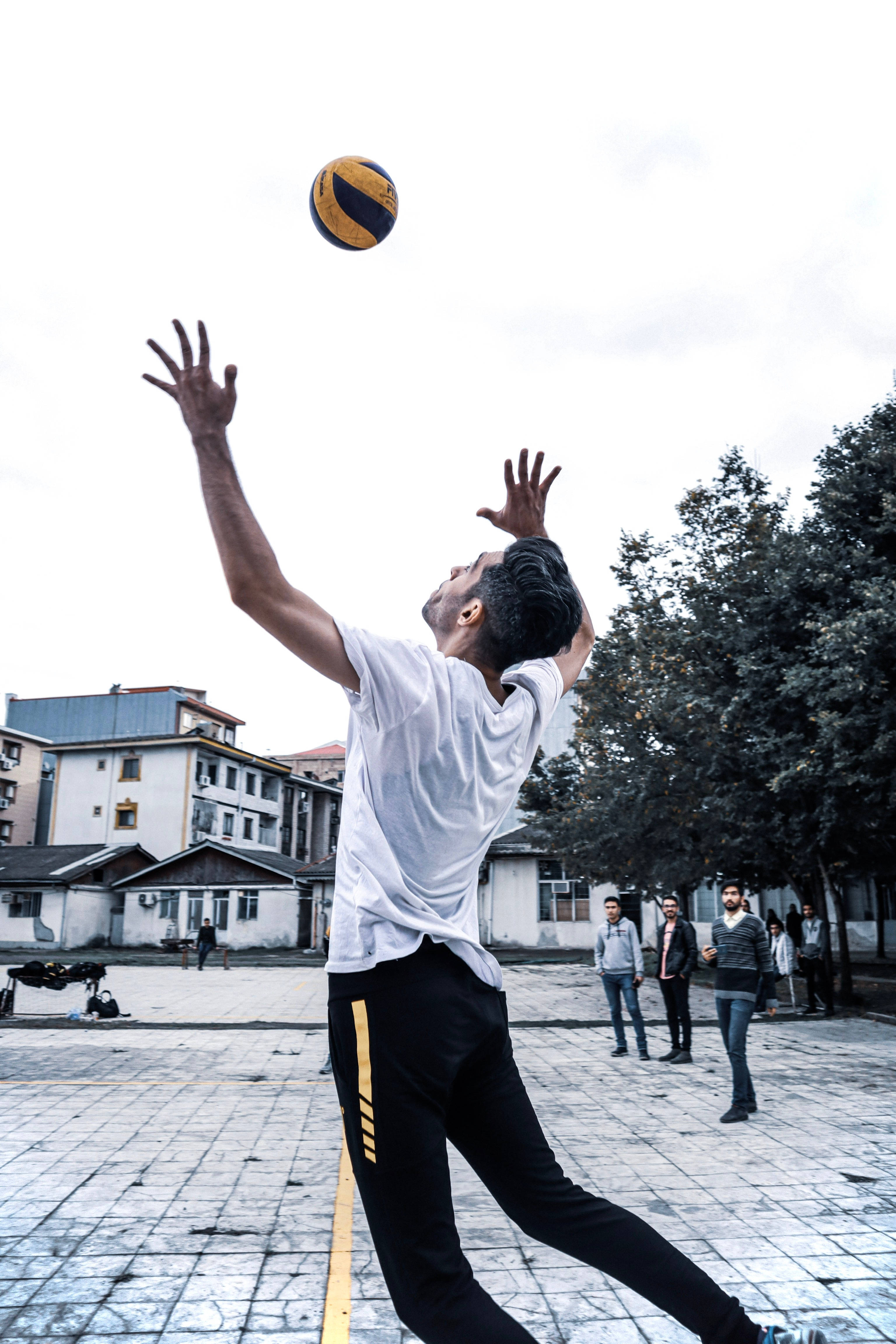 volleyball player, white shirt, urban courtyard, 4K Phone Wallpaper