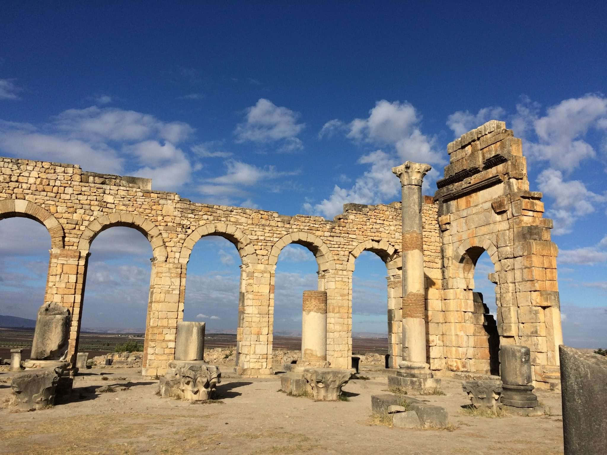Volubilis, stone aqueduct ruins, arched columns, Full HD Desktop Wallpaper
