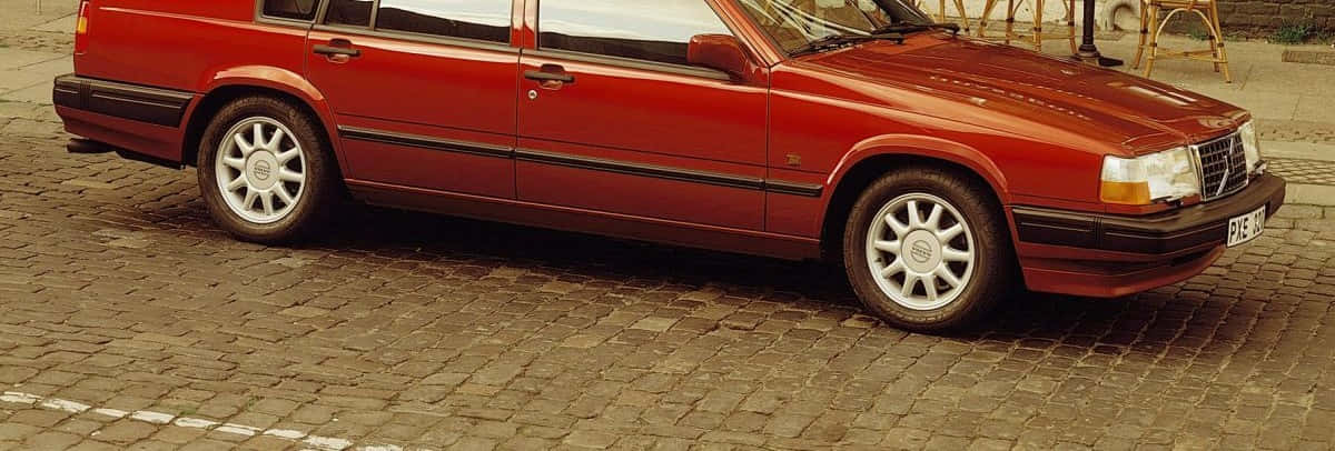Volvo 940, red station wagon, cobblestone street, SD Desktop Wallpaper