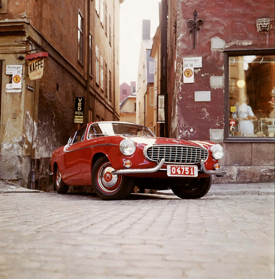 Volvo P1800, vintage red, cobblestone alley, SD Phone Wallpaper