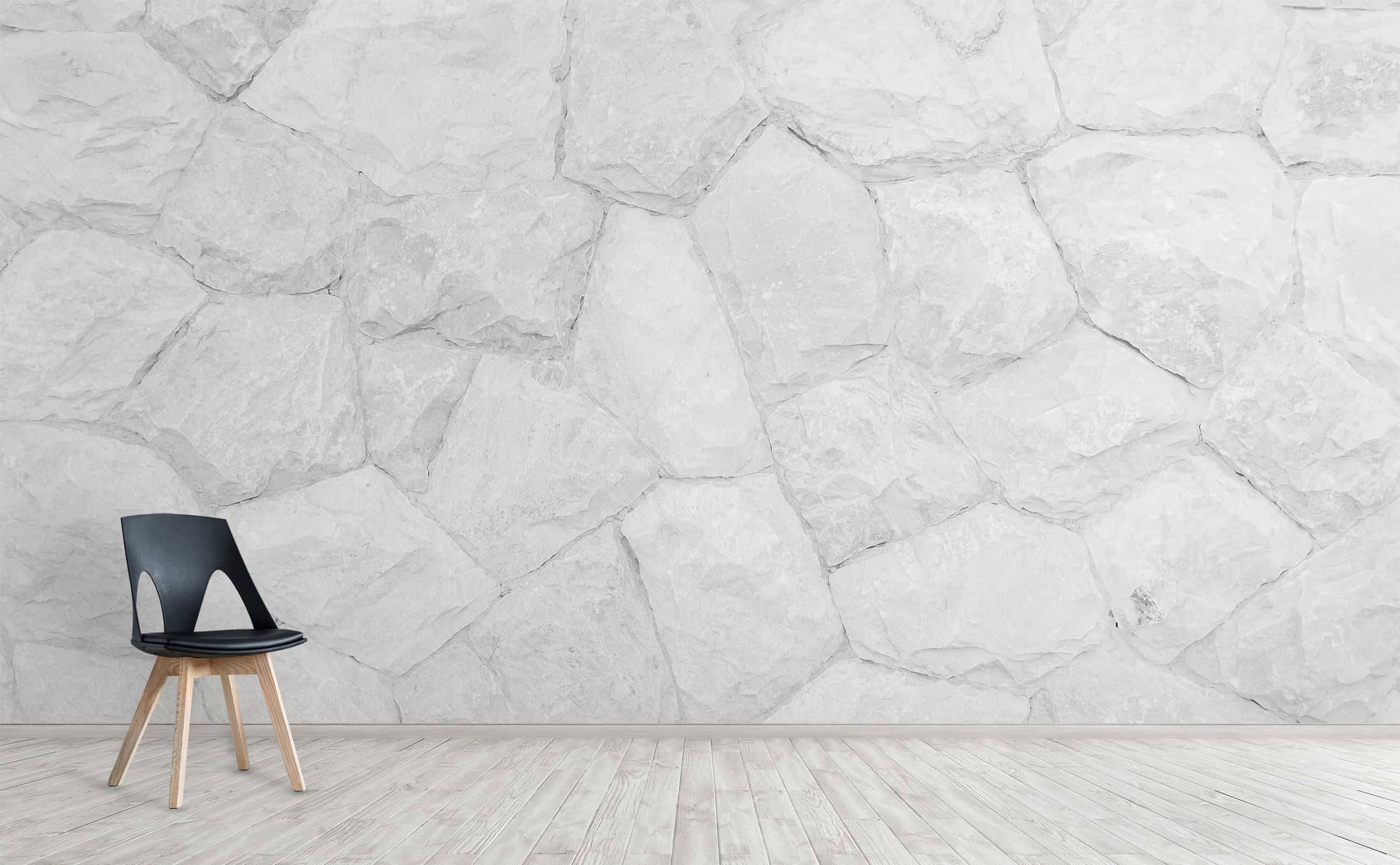 white stone wall, black chair, wooden legs, 2K Desktop Wallpaper