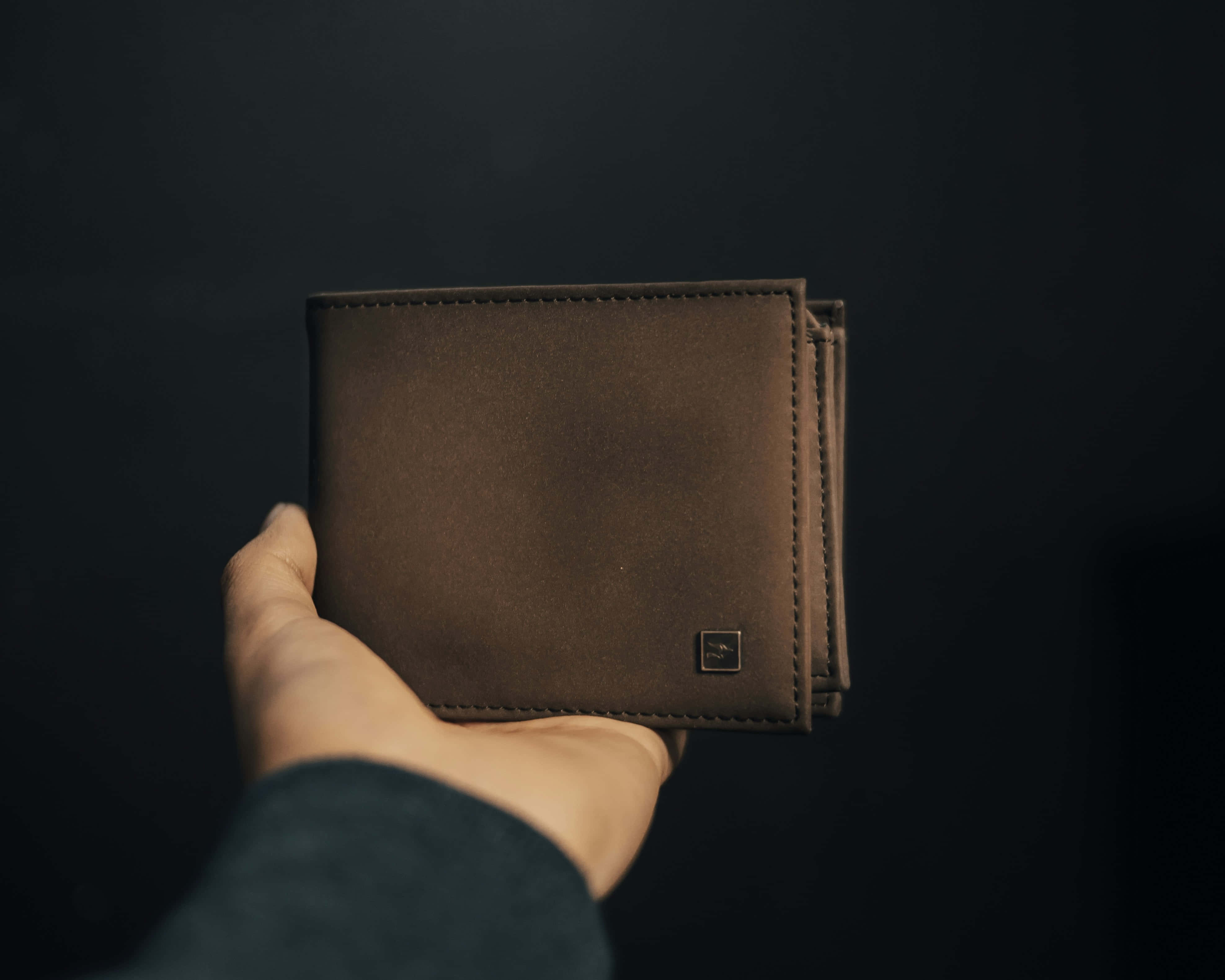 brown leather wallet, visible stitching, dark background, 4K Desktop Wallpaper