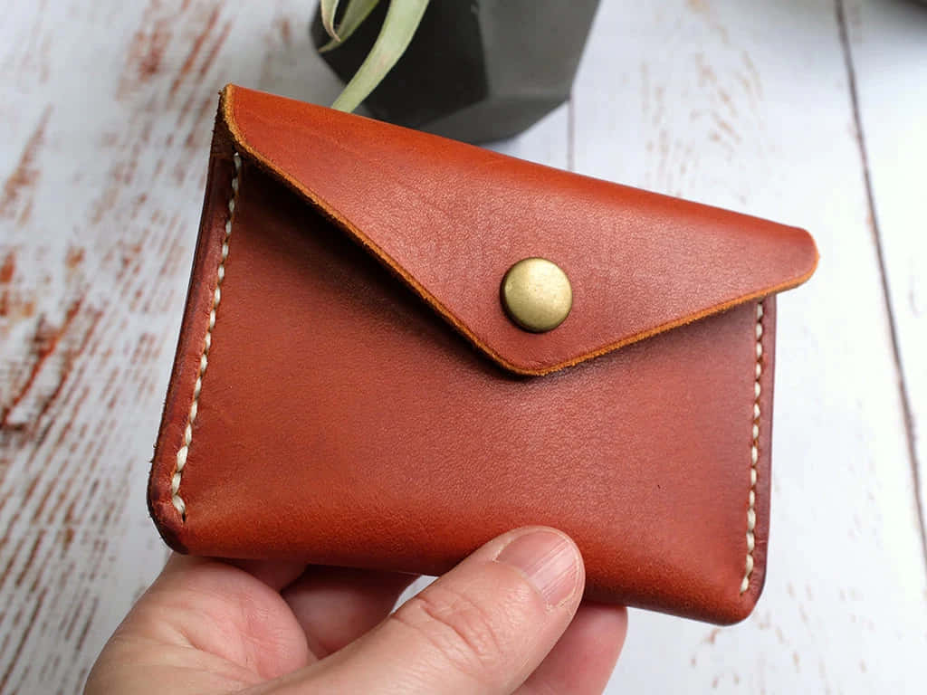 handheld leather wallet, brass snap closure, cream stitching, SD Desktop Wallpaper