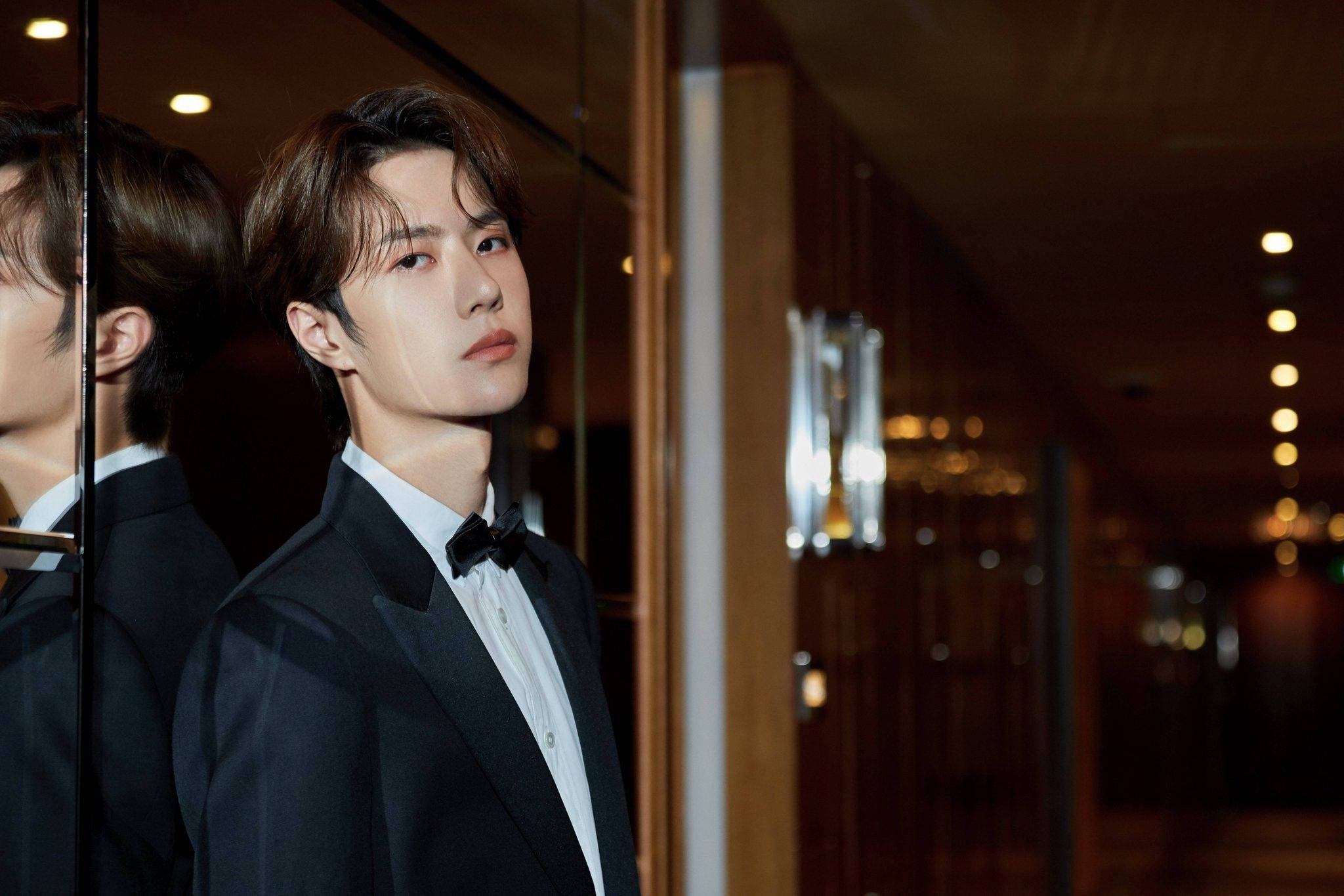 Wang yibo, black tuxedo, warmly lit hallway, Full HD Desktop Wallpaper