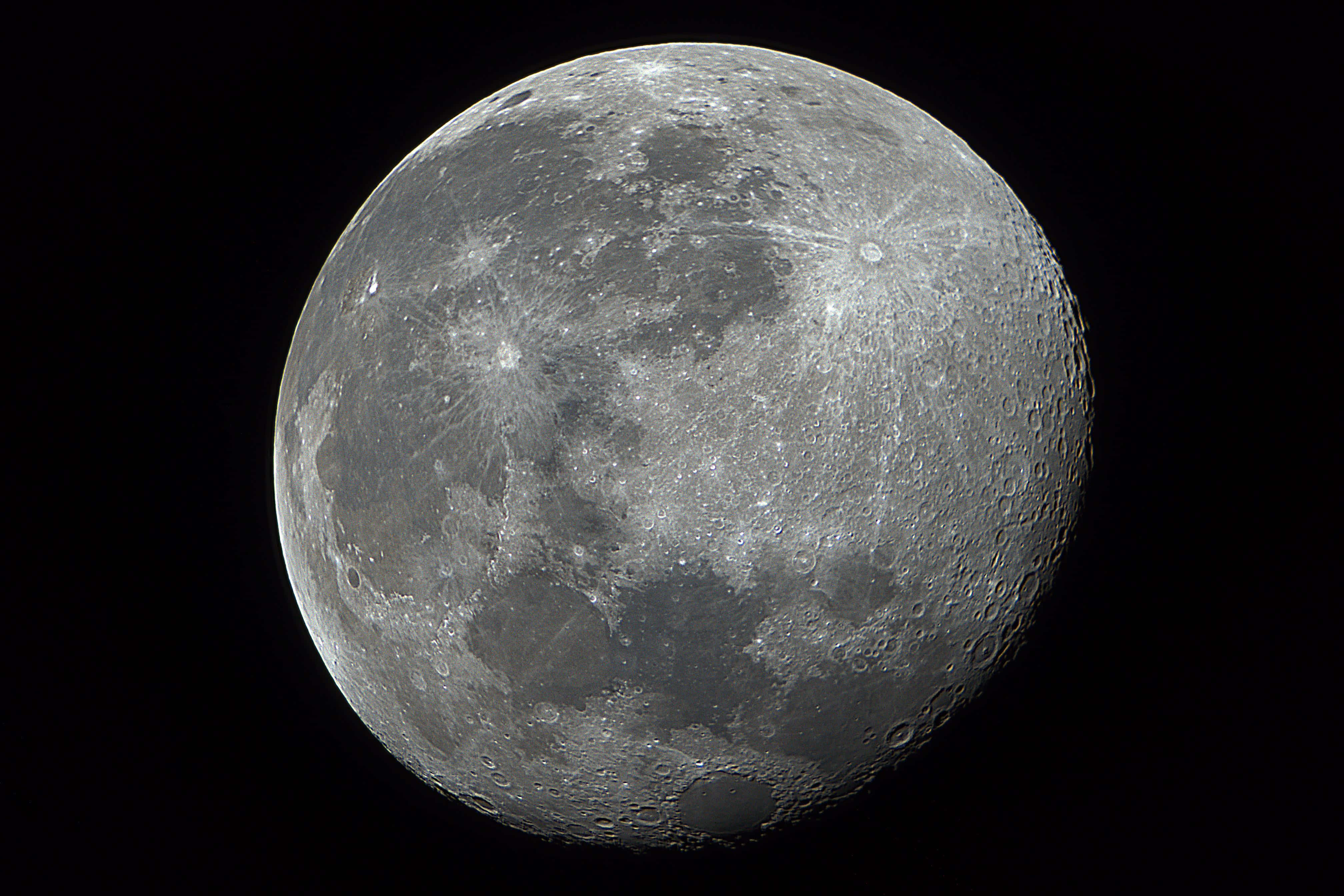 Waning Gibbous Moon, cratered gray surface, pitch-black void, 4K Desktop Wallpaper
