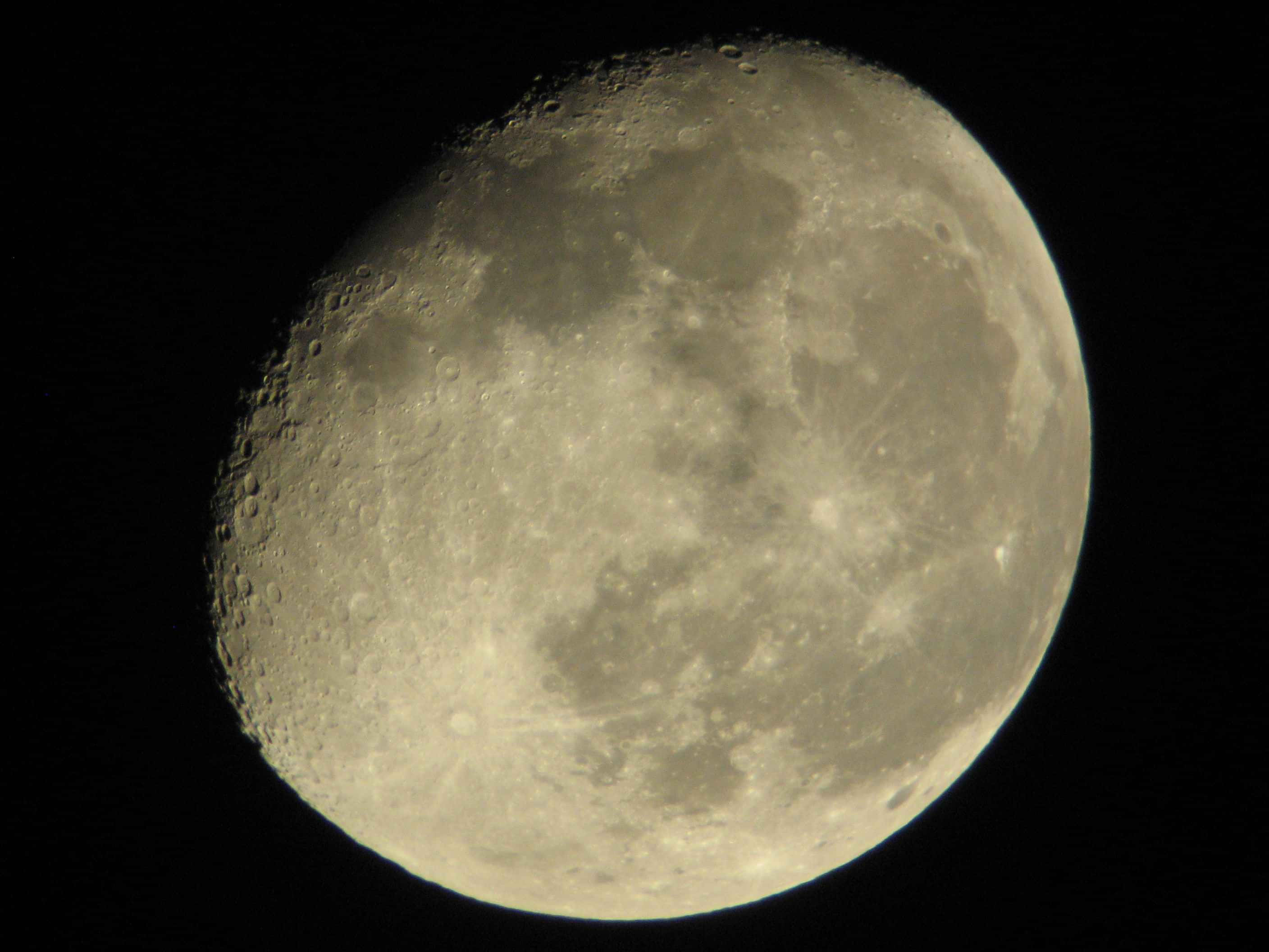 Waning Gibbous Moon, cratered surface, pitch-black sky, 2K Desktop Wallpaper